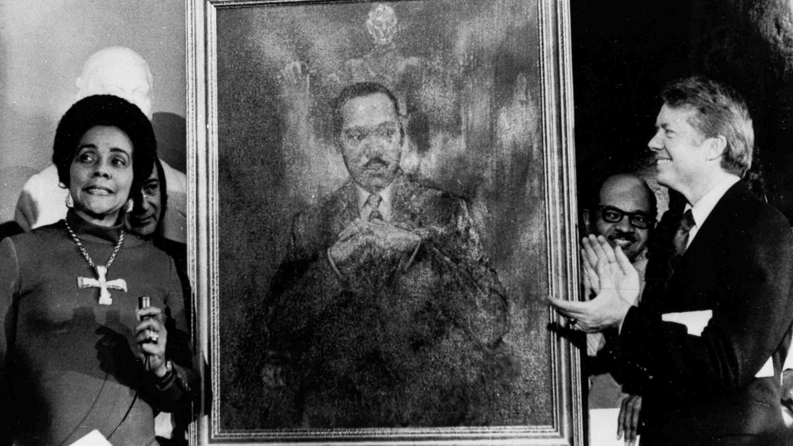 FILE - Coretta Scott King, widow of slain civil rights leader Martin Luther King Jr., speaks at an unveiling of a portrait of King by artist George Mandus, Feb. 18, 1974, and dedicated by Gov. Jimmy Carter. It is the first portrait of an African American to be represented in the state's official portrait gallery. (AP Photo/File)