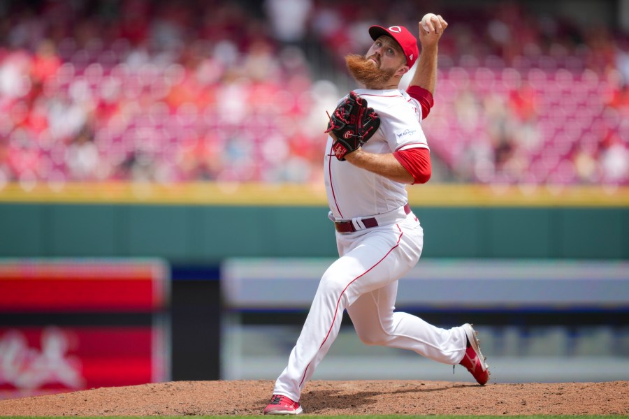 Cincinnati Reds' Buck Farmer throws during the ninth inning of a baseball game against the Colorado Rockies in Cincinnati, Wednesday, June 21, 2023. (AP Photo/Aaron Doster)