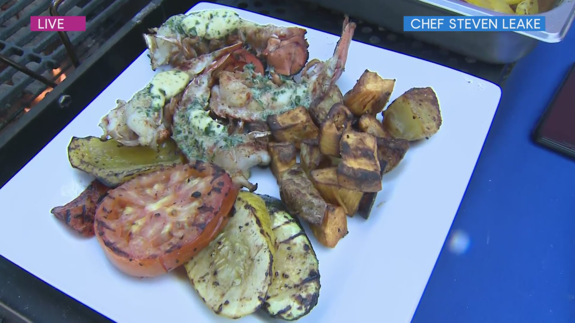 Chef Steven Leake serves up lobster tails with herb butter