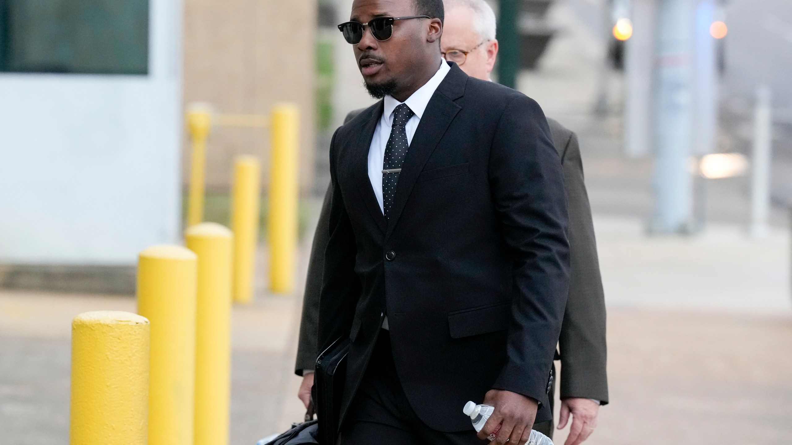 Former Memphis police officer Justin Smith arrives at the federal courthouse for the day's proceedings during the trial in the Tyre Nichols case Wednesday, Sept. 25, 2024, in Memphis, Tenn. (AP Photo/George Walker IV)