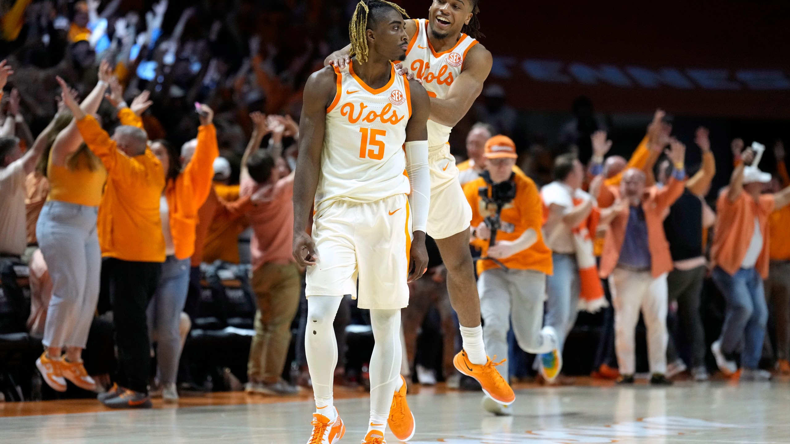 Tennessee guard Jahmai Mashack (15) is congratulated by Chaz Lanier after Mashack scored the winning three-point basket as time expired in the second half to give Tennessee a 79-76 win against Alabama in an NCAA college basketball game Saturday, March 1, 2025, in Knoxville, Tenn. (AP Photo/Mark Humphrey)