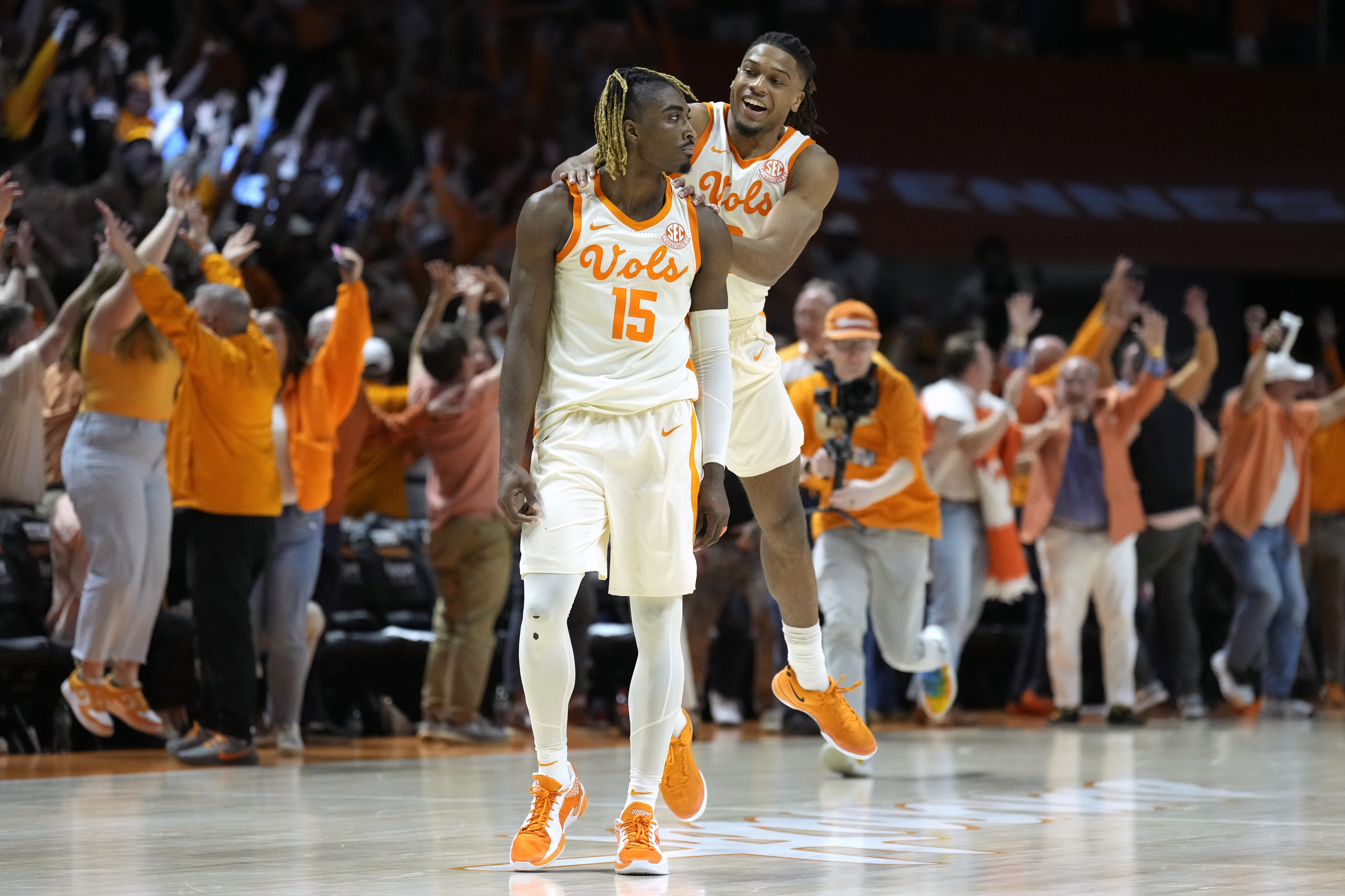 Tennessee guard Jahmai Mashack (15) is congratulated by Chaz Lanier after Mashack scored the winning three-point basket as time expired in the second half to give Tennessee a 79-76 win against Alabama in an NCAA college basketball game Saturday, March 1, 2025, in Knoxville, Tenn. (AP Photo/Mark Humphrey)