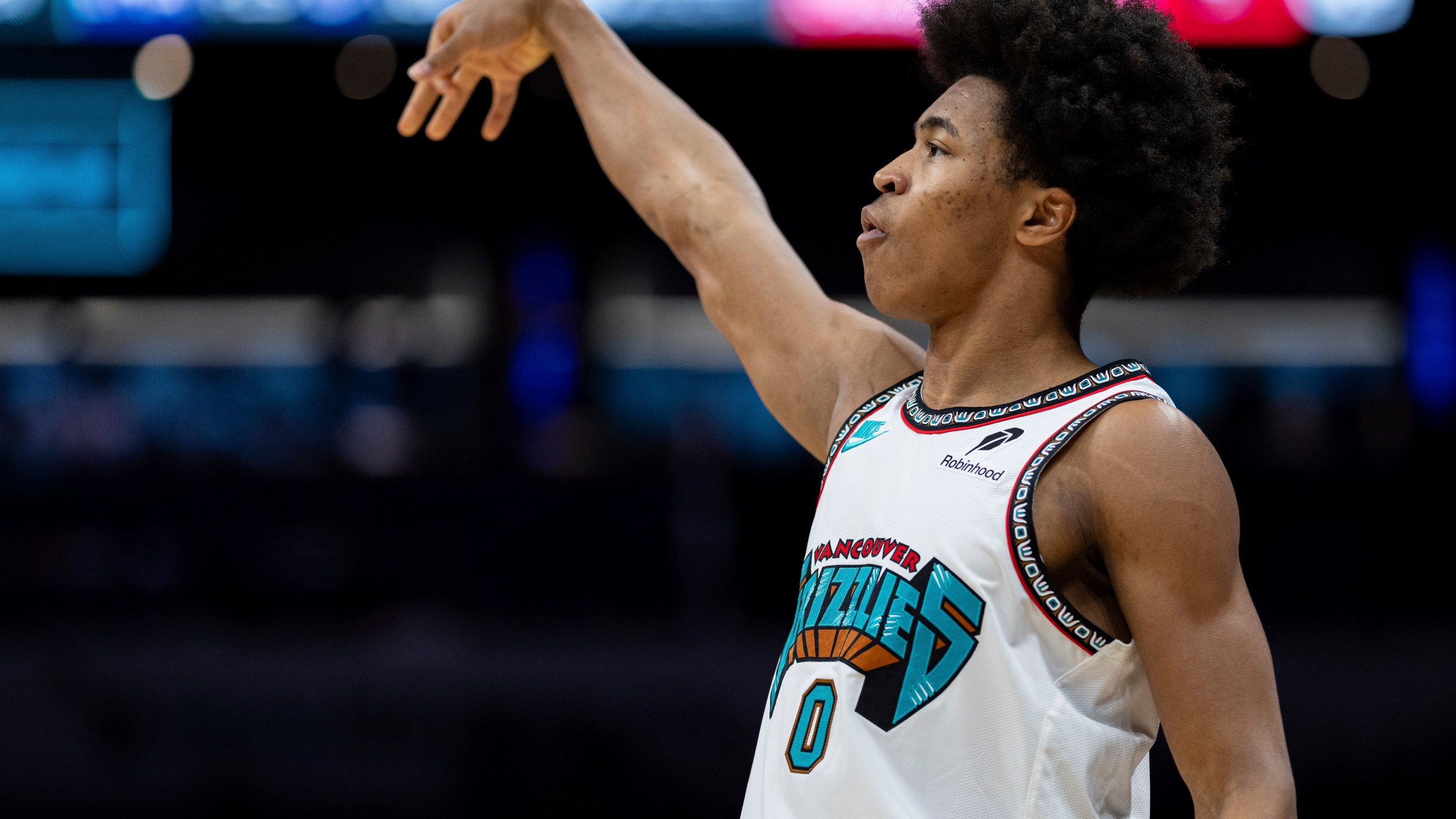 Memphis Grizzlies forward Jaylen Wells (0) watches his shot during the first half of an NBA basketball game against the Charlotte Hornets, Tuesday, April 8, 2025, in Charlotte, N.C. (AP Photo/Jacob Kupferman)