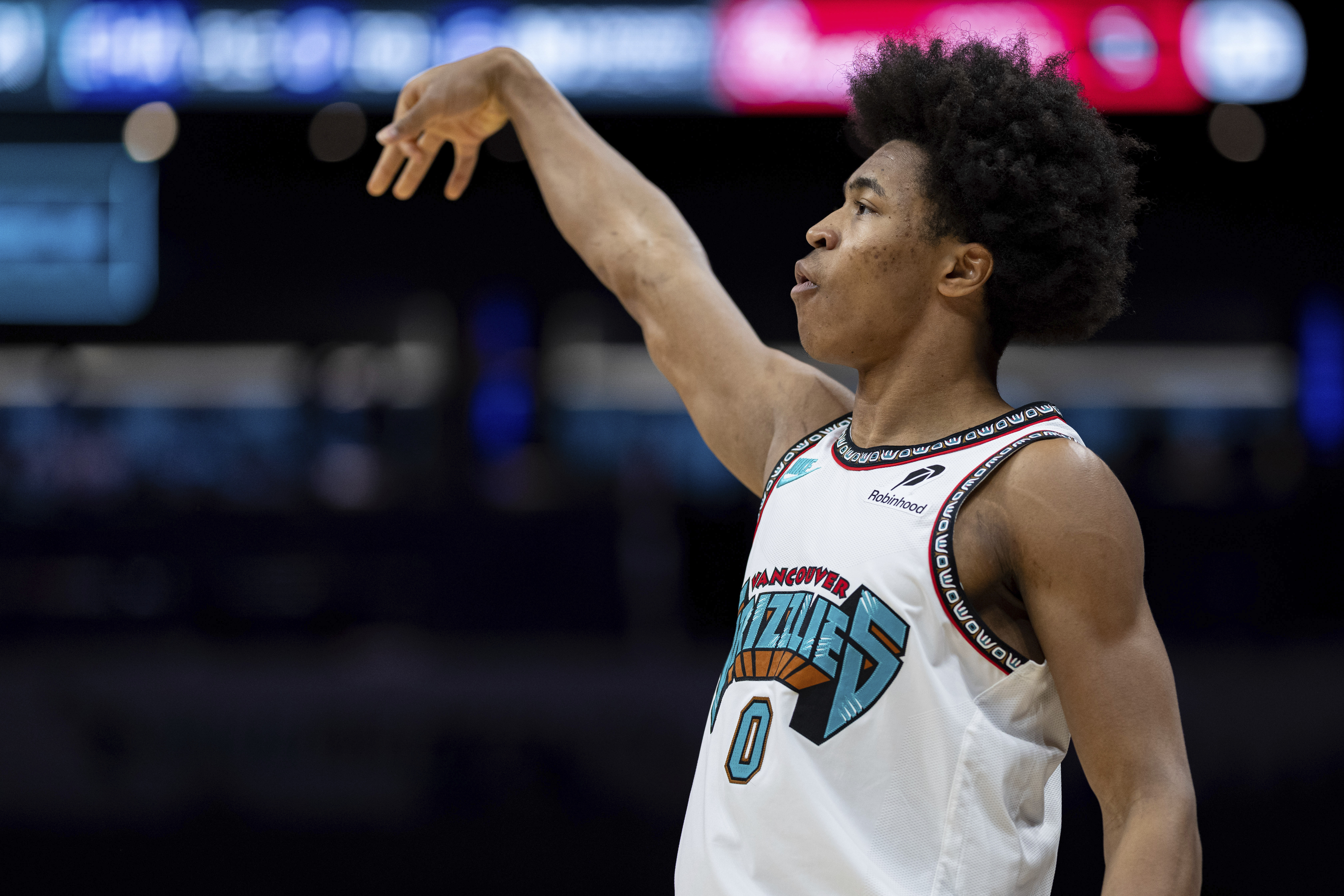 Memphis Grizzlies forward Jaylen Wells (0) watches his shot during the first half of an NBA basketball game against the Charlotte Hornets, Tuesday, April 8, 2025, in Charlotte, N.C. (AP Photo/Jacob Kupferman)