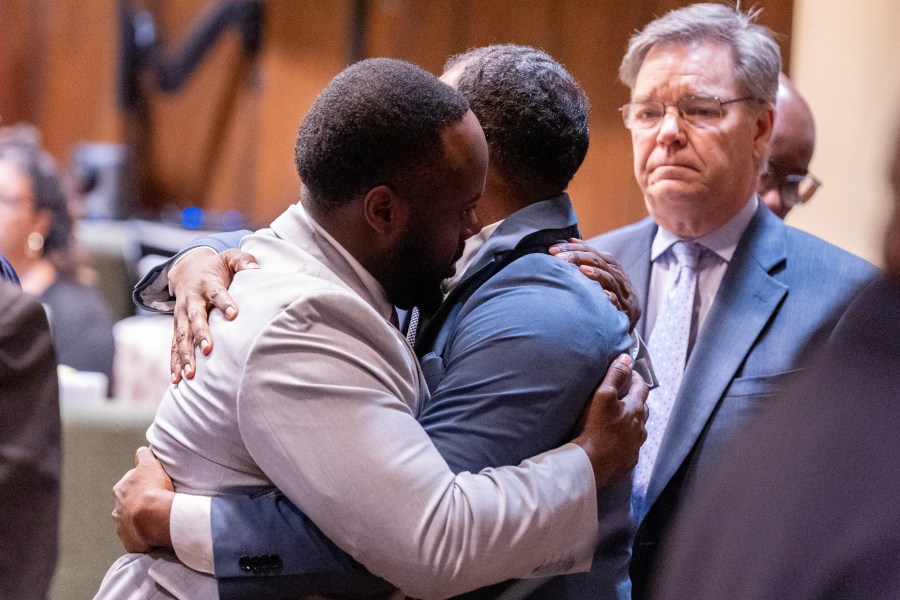 Former Memphis Police Department officers Tadarrius Bean, left, and Justin Smith Jr. hug after they were acquitted of state charges, including second-degree murder, in the fatal beating of Tyre Nichols after he ran away from a traffic stop. Wednesday, May 7, 2025, in Memphis, Tenn. (Chris Day/Commercial Appeal/USA Today Network via AP, Pool)
