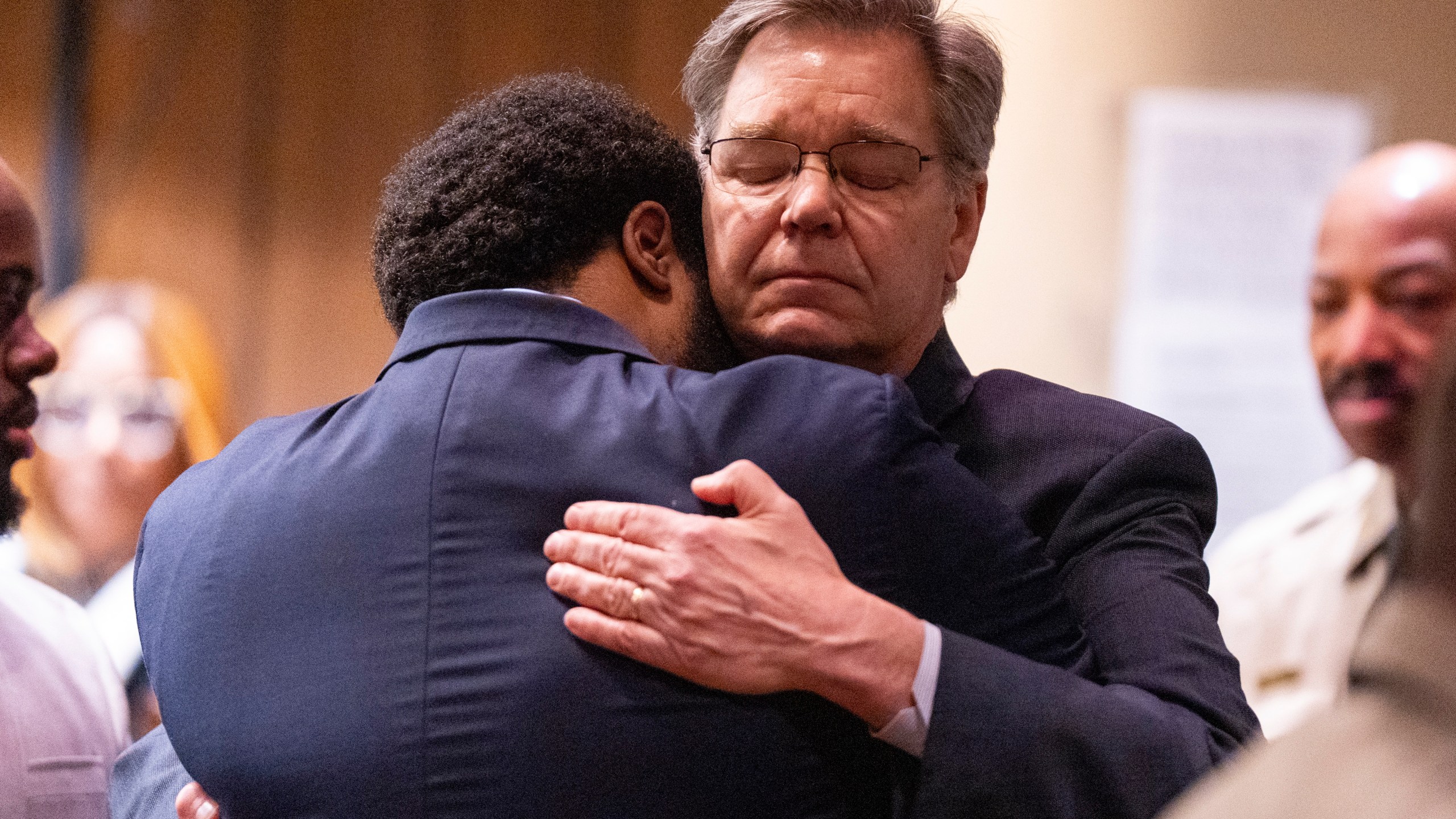 Former Memphis Police Department officer Demetrius Haley, left, hugs his defense attorney, Michael Stengel, right, after Haley and the other two former MPD officers were found not guilty on all charges by the jury on the ninth day of the trial for the death of Tyre Nichols in Memphis, Tenn., on Wednesday, May 7, 2025. (Chris Day/Commercial Appeal/USA Today Network via AP, Pool)