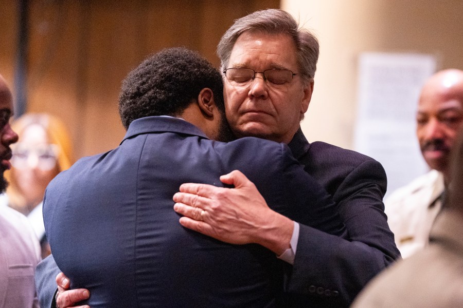 Former Memphis Police Department officer Demetrius Haley, left, hugs his defense attorney, Michael Stengel, right, after Haley and the other two former MPD officers were found not guilty on all charges by the jury on the ninth day of the trial for the death of Tyre Nichols in Memphis, Tenn., on Wednesday, May 7, 2025. (Chris Day/Commercial Appeal/USA Today Network via AP, Pool)