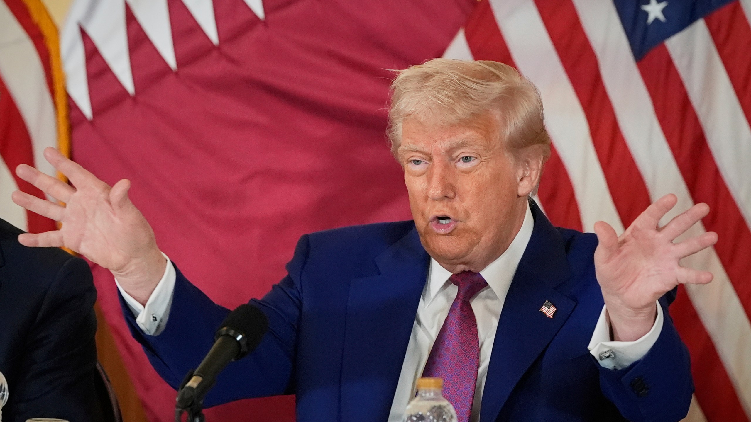 President Donald Trump gestures during a business roundtable, Thursday, May 15, 2025, in Doha, Qatar. (AP Photo/Alex Brandon)