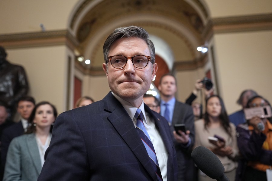 FILE - Speaker of the House Mike Johnson, R-La., talks to reporters just after House Republicans narrowly approved their budget framework, at the Capitol in Washington, April 10, 2025. (AP Photo/J. Scott Applewhite, File)