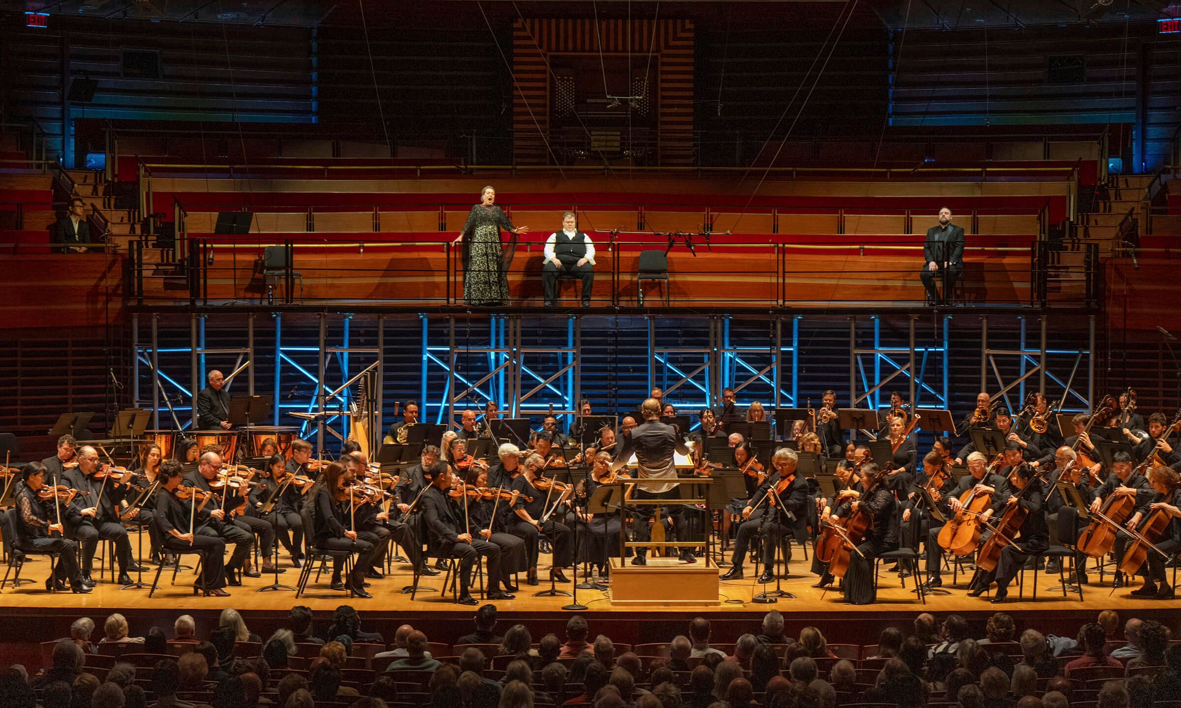This image released by the Philadelphia Opera shows Soprano Nina Stemme, from top left, tenor Stuart Skelton, and baritone Brian Mulligan, with the Philadelphia Orchestra led by music director Yannick Nézet-Séguin, foreground center, during a concert performance of Wagner’s “Tristan und Isolde” at Marian Anderson Hall in Philadelphia on June 1, 2025. (Jessica Griffin/Philadelphia Opera via AP)