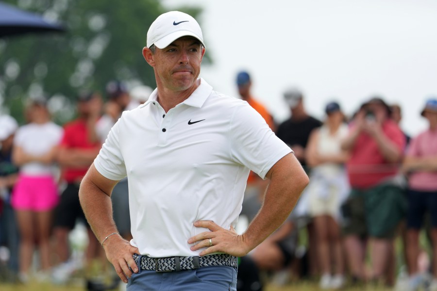 Rory McIlroy, of Northern Ireland, stands on the 11th green after putting in during the final round of the U.S. Open golf tournament at Oakmont Country Club Sunday, June 15, 2025, in Oakmont, Pa. (AP Photo/Gene J. Puskar)