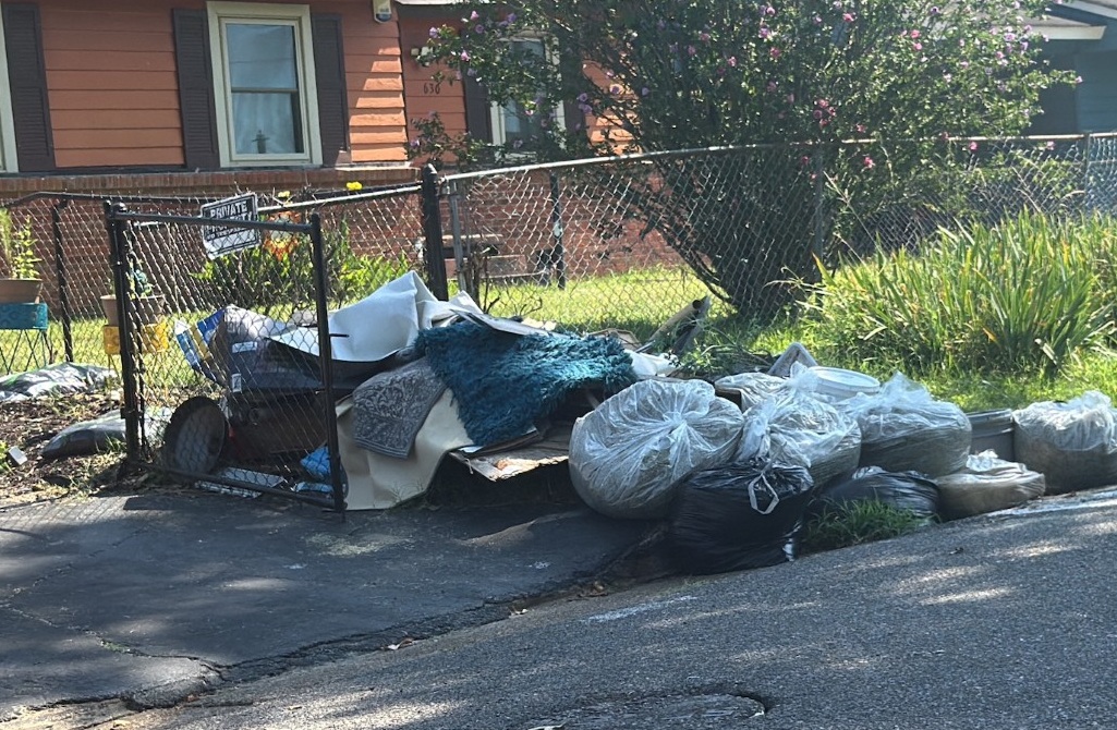 Garbage piled up outside Westwood woman's home