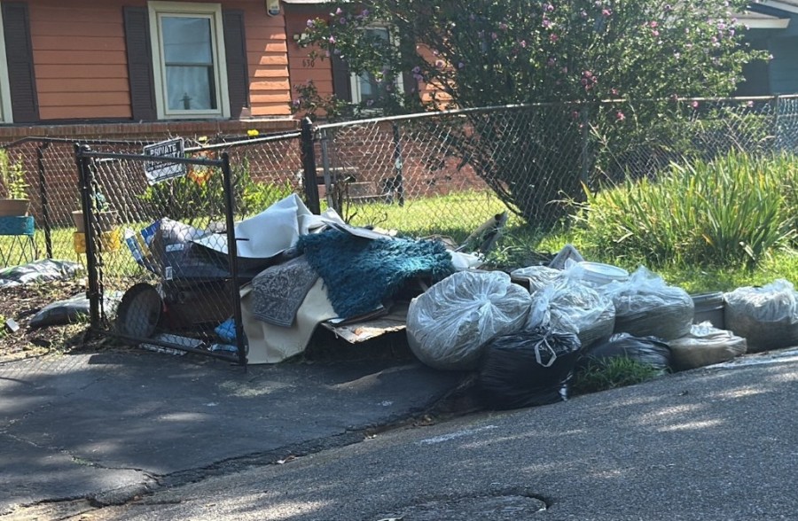 Garbage piled up outside Westwood woman's home
