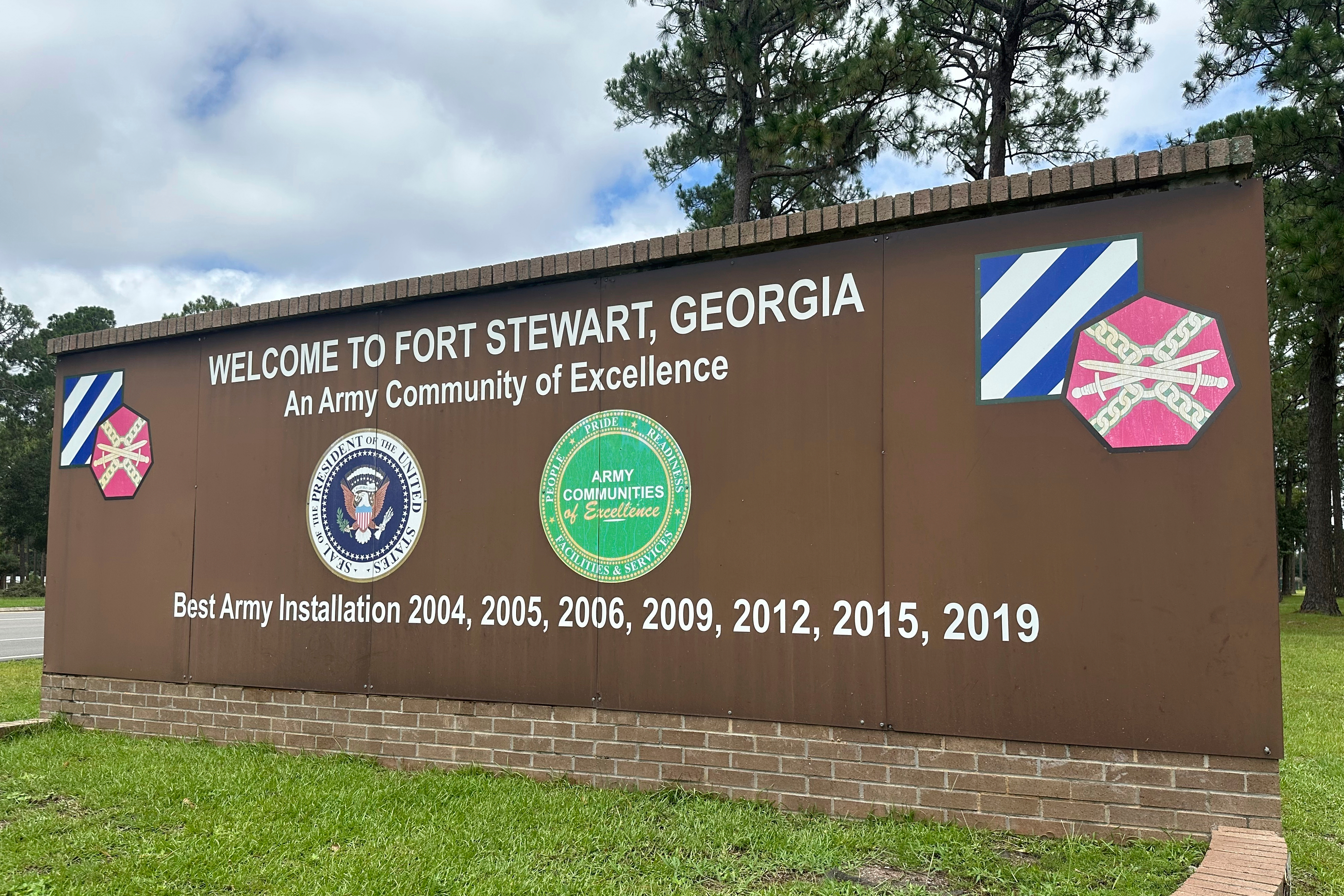 A sign outside the main gate of Fort Stewart, Georgia, is shown on Wednesday, Aug. 6, 2025. (AP Photo/Russ Bynum)