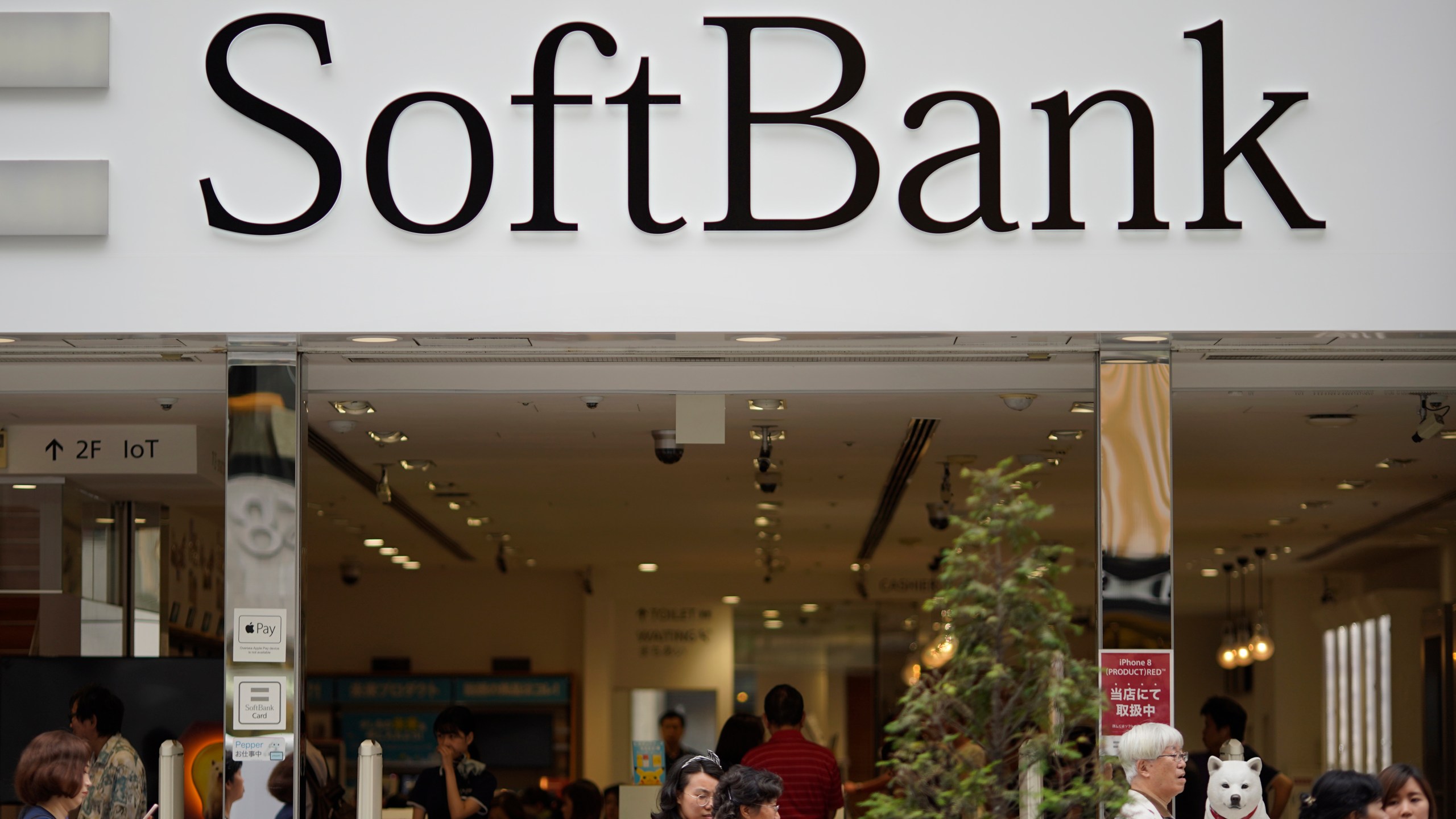 FILE - The logo of Japanese mobile provider SoftBank is seen at its shop in Tokyo on June 14, 2018. (AP Photo/Shuji Kajiyama, File)