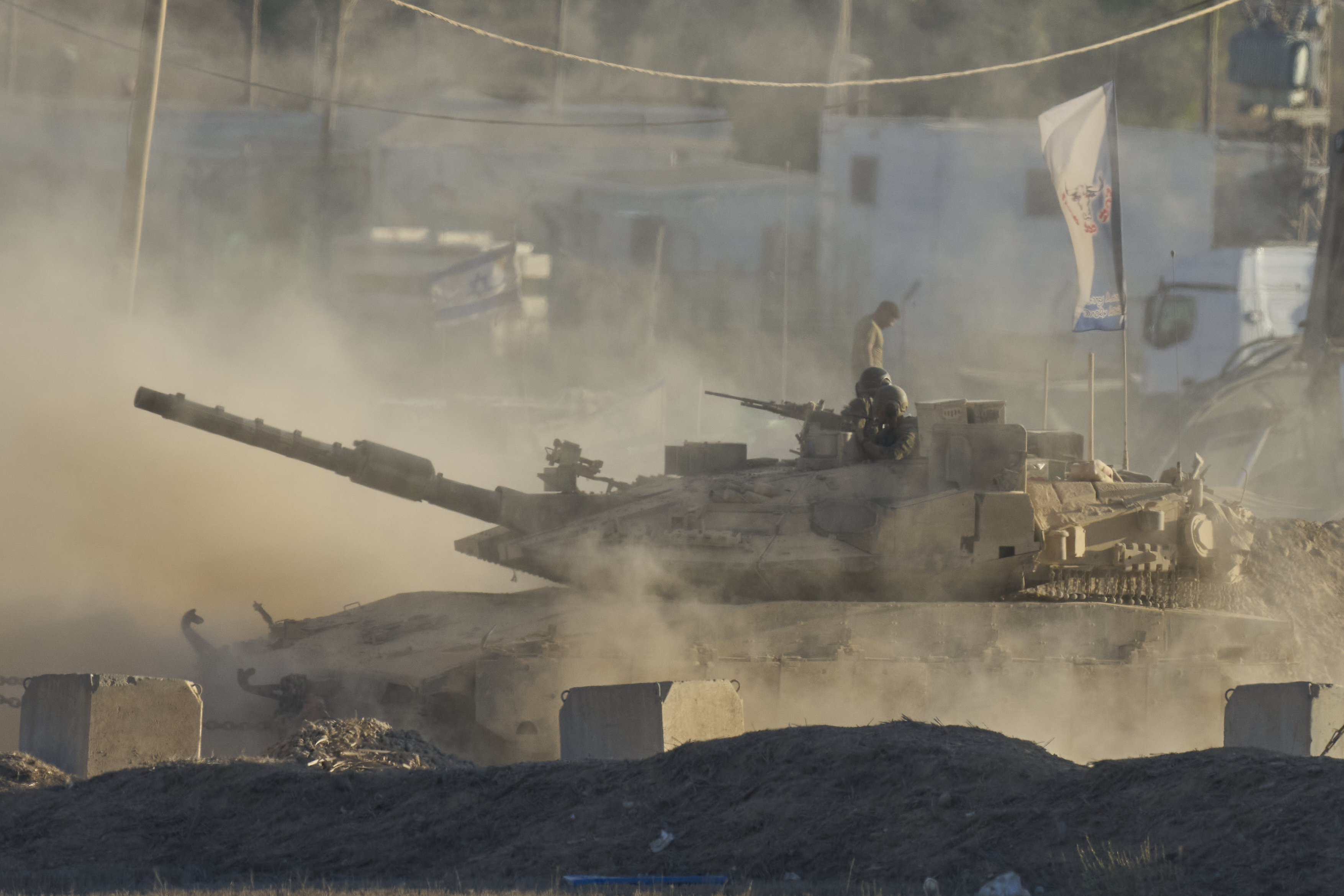 An Israeli tank moves near the border of the Gaza Strip in southern Israel, Wednesday, Aug. 6, 2025. (AP Photo/Ohad Zwigenberg)