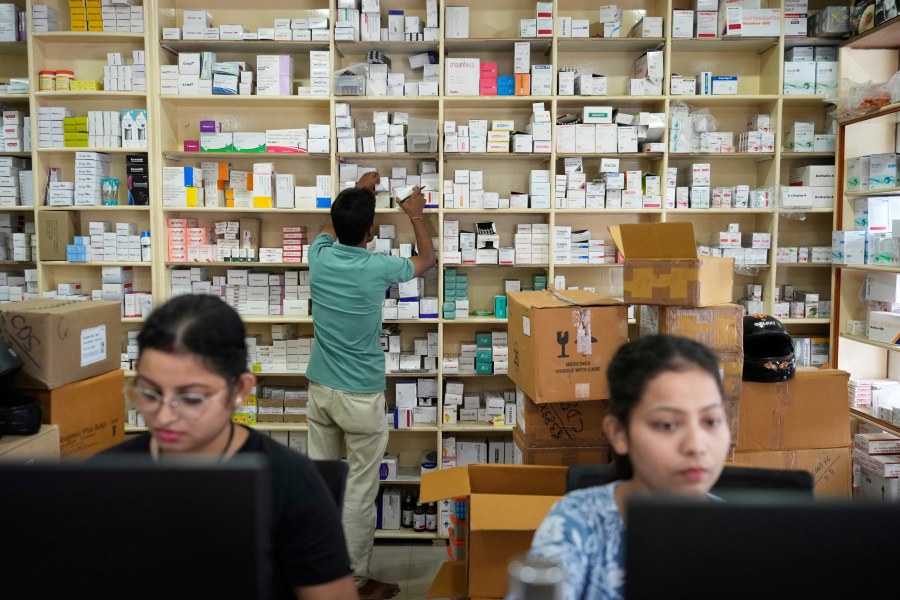 An employee sorts medicines in a medicine wholesale shop in Guwahati, India, Thursday, Aug. 7, 2025. (AP Photo/Anupam Nath)