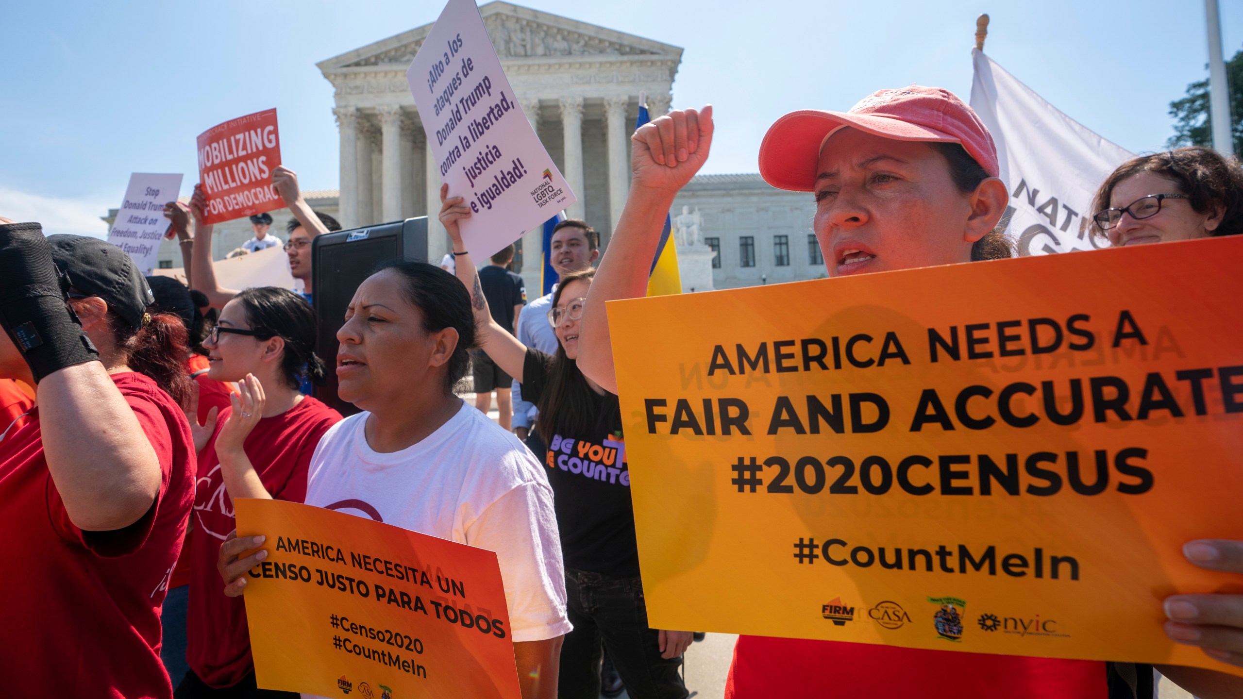 FILE - Demonstrators gather at the Supreme Court as the justices finish the term with key decisions on gerrymandering and a census case involving an attempt by the Trump administration to ask everyone about their citizenship status in the 2020 census, on Capitol Hill in Washington, June 27, 2019. (AP Photo/J. Scott Applewhite, file)