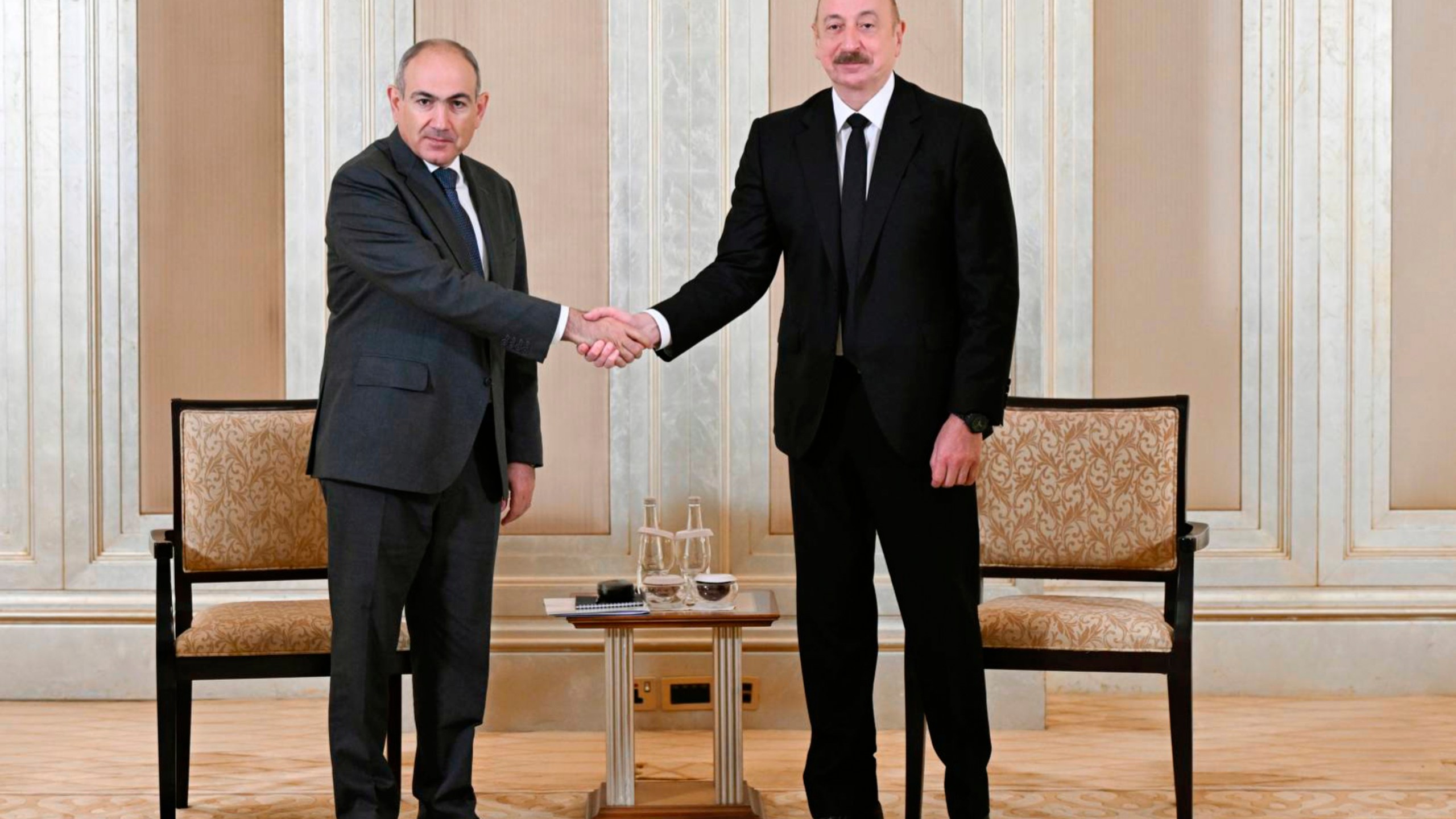 In this photo provided by the Azerbaijan's Presidential Press Office on Thursday, July 10, 2025, Azerbaijani President Ilham Aliyev, right, and Prime Minister of Armenia Nikol Pashinyan pose for a photo prior to their talks in Abu Dhabi, United Arab Emirates. (Azerbaijani Presidential Press Office via AP)