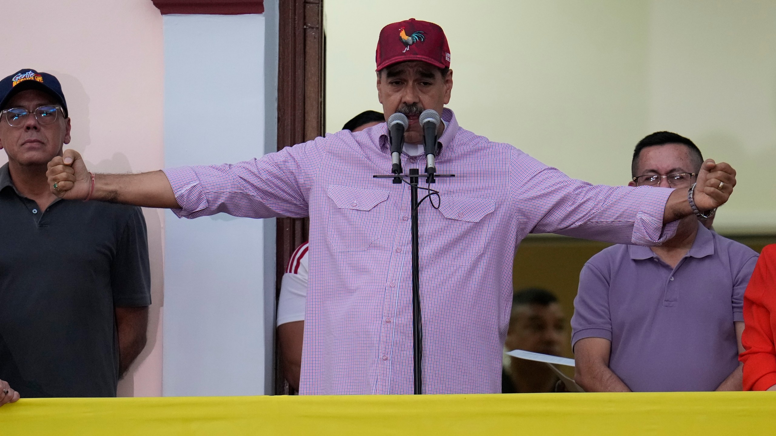 Venezuela's President Nicolas Maduro addresses supporters during an event marking the anniversary of his disputed re-election and the birthday of late President Hugo Chavez, in Caracas, Venezuela, Monday, July 28, 2025. (AP Photo/Ariana Cubillos)