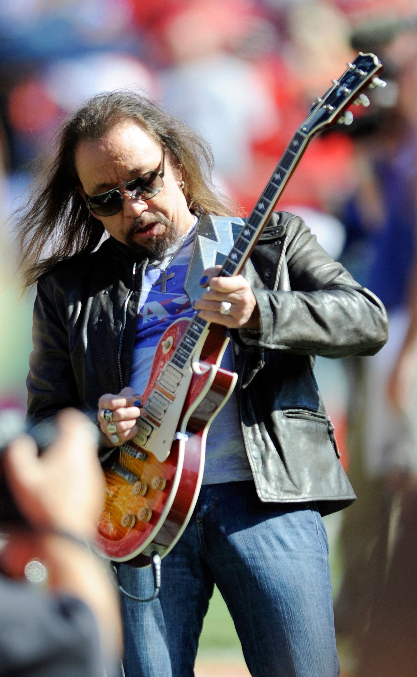 FILE - In this Oct. 4, 2009 file photo, former KISS lead guitarist Ace Frehley plays the national anthem before an NFL football game between the Kansas City Chiefs and the New York Giants in Kansas City, Mo. (AP Photo/L.G. Patterson, File)