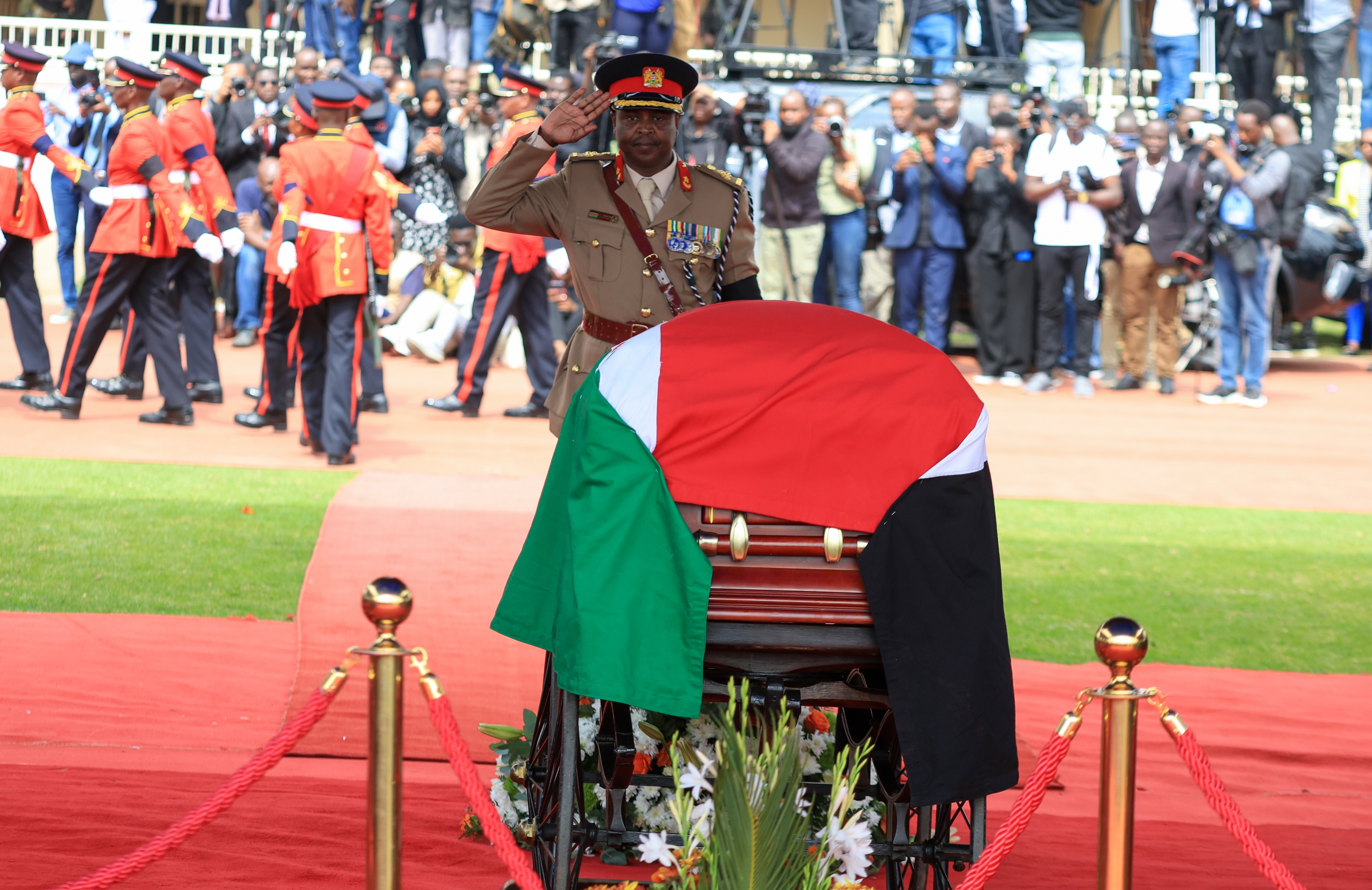 A military officer salutes at a state funeral for former Kenya Prime Minister Raila Odinga at Nyayo National Stadium in Nairobi, Kenya, Friday, Oct. 17, 2025. (AP Photo/Andrew Kasuku)