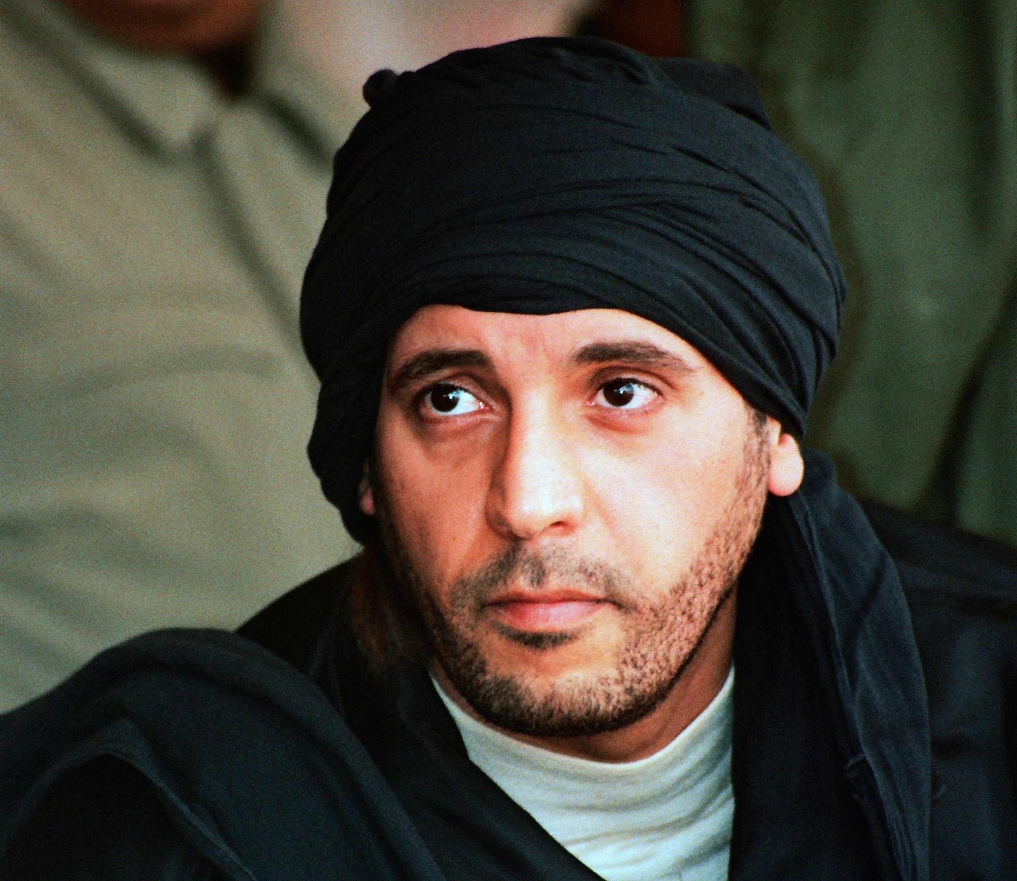 FILE - In this undated file photo made available Sept. 25, 2011, Hannibal Gadhafi, son of ousted Libyan leader Moammar Gadhafi, watches an elite military unit exercise in Zlitan, Libya. (AP Photo/Abdel Magid al-Fergany, File)