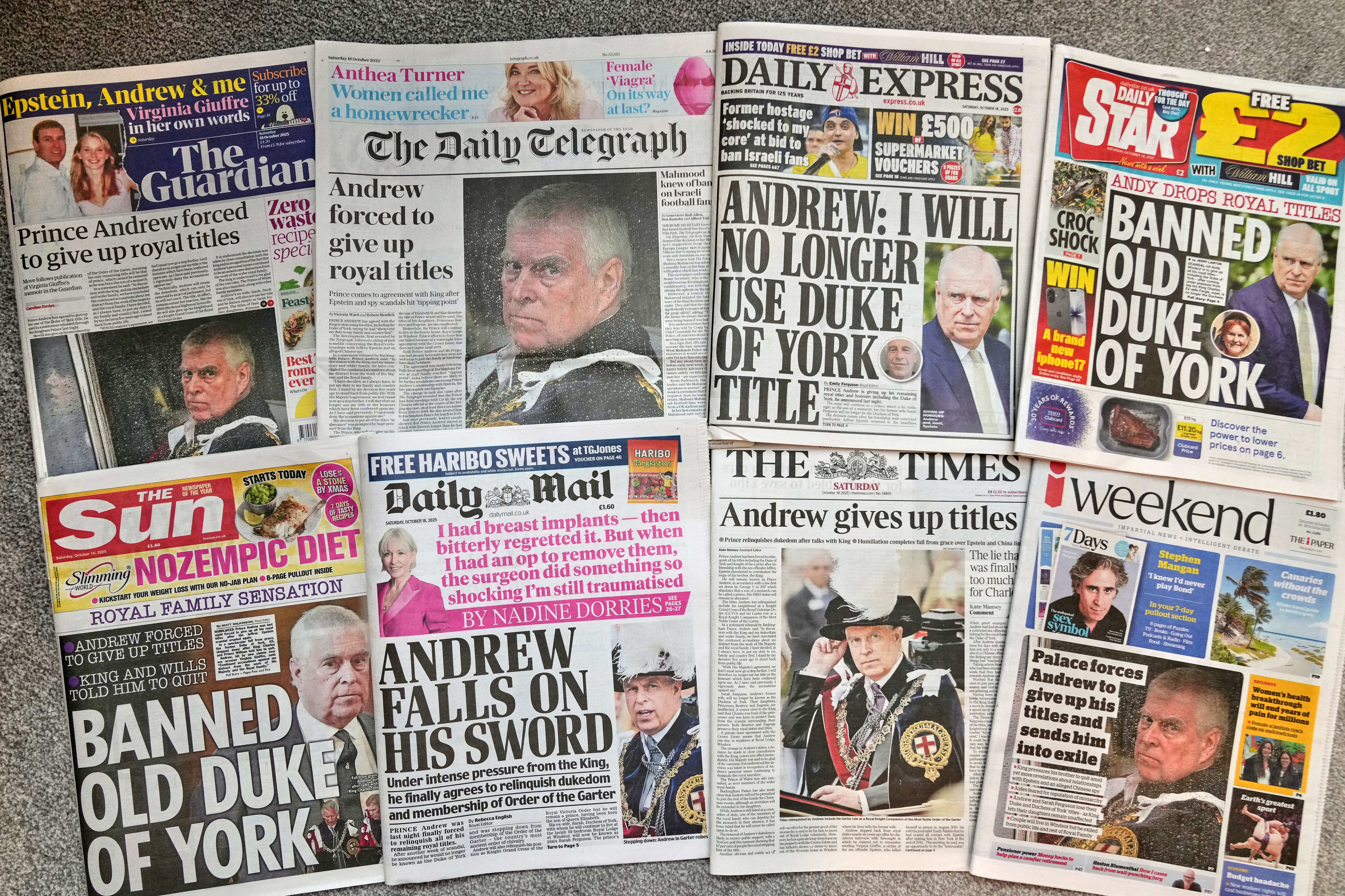 A selection of British national newspapers showing the front pages and their reaction to Prince Andrew announcing that he will relinquish his Duke of York title and the Order of the Garter, amid ongoing problems in his personal life, in London, Saturday, Oct. 18, 2025. (AP Photo/Alastair Grant)