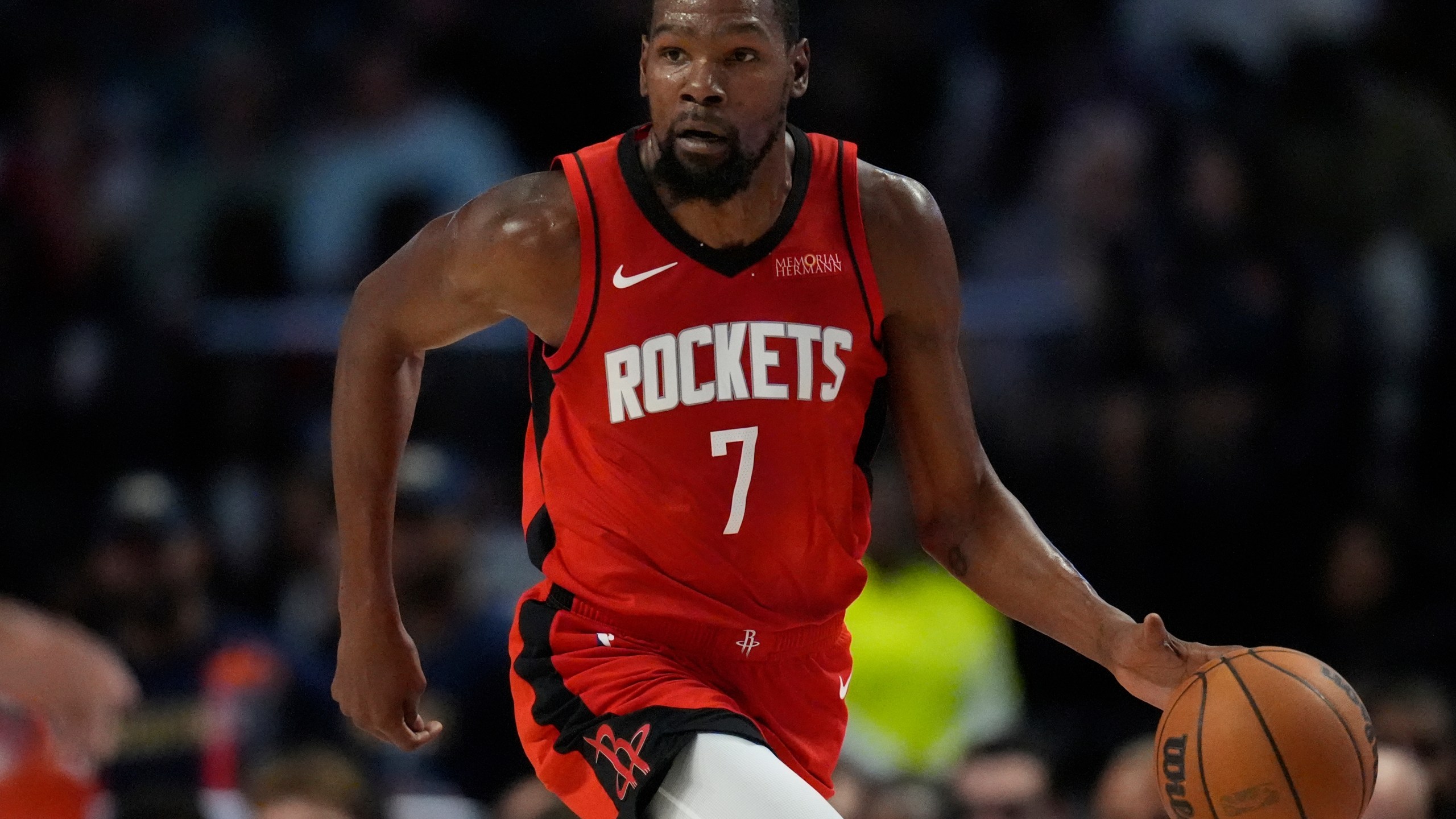 Houston Rockets forward Kevin Durant (7) moves the ball against the New Orleans Pelicans during the first half of an NBA preseason basketball game, Tuesday, Oct. 14, 2025, in Birmingham, Ala. (AP Photo/Mike Stewart)