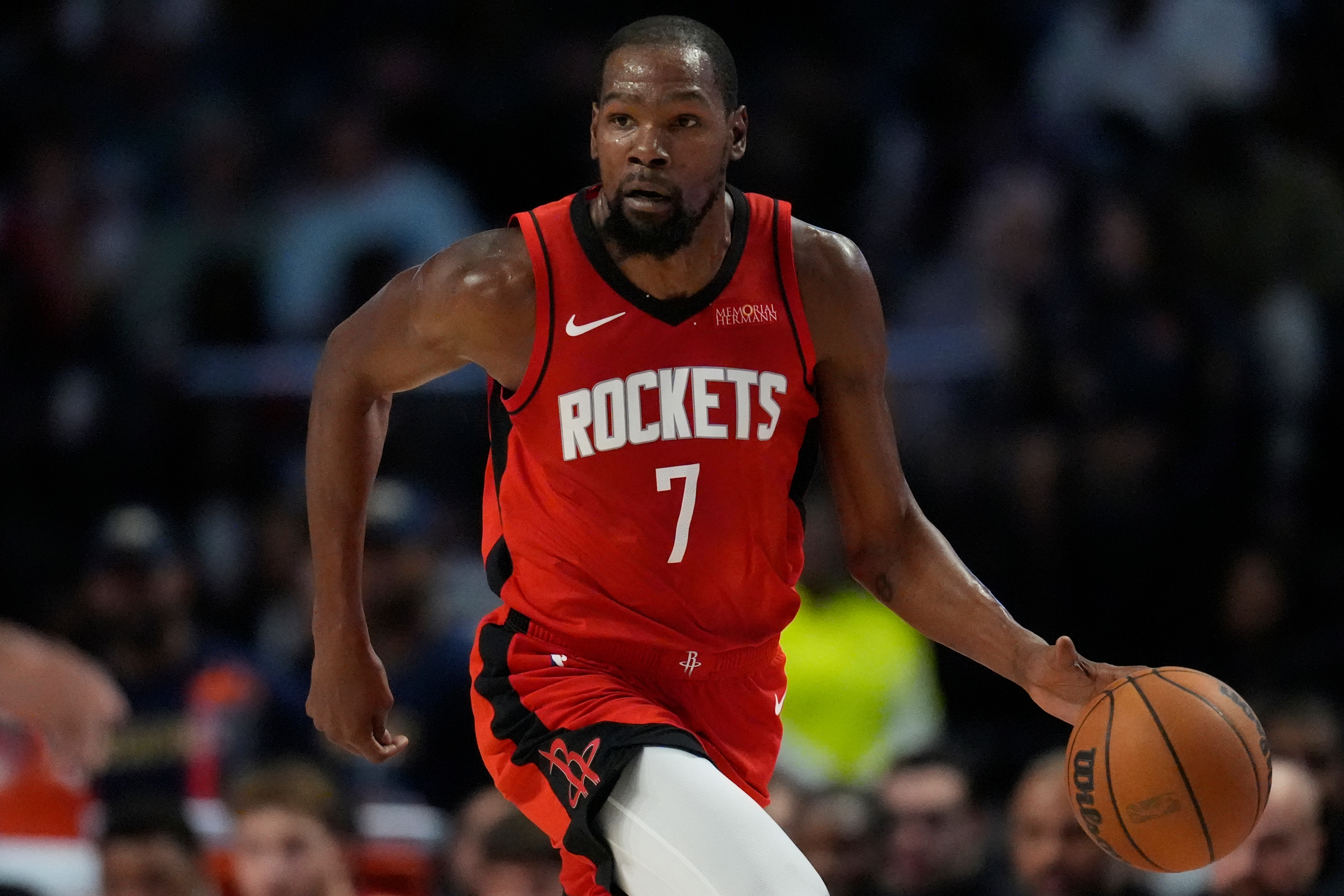 Houston Rockets forward Kevin Durant (7) moves the ball against the New Orleans Pelicans during the first half of an NBA preseason basketball game, Tuesday, Oct. 14, 2025, in Birmingham, Ala. (AP Photo/Mike Stewart)