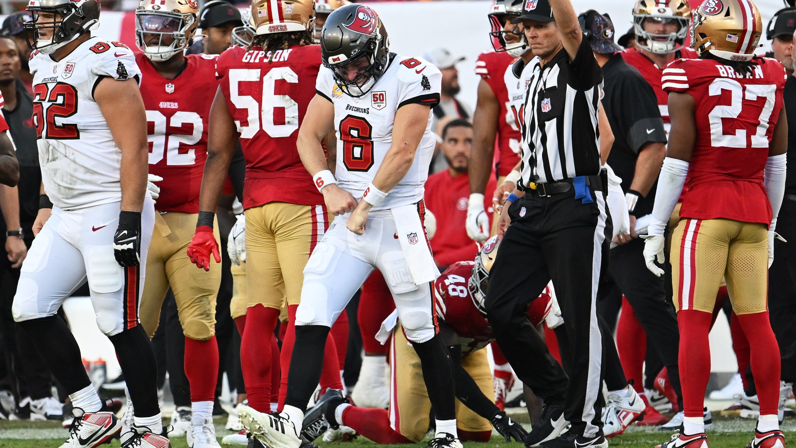 Tampa Bay Buccaneers quarterback Baker Mayfield (6) reacts after running for a first down during the second half of an NFL football game against the San Francisco 49ers in Tampa, Fla., Sunday, Oct. 12, 2025. (AP Photo/Jason Behnken)