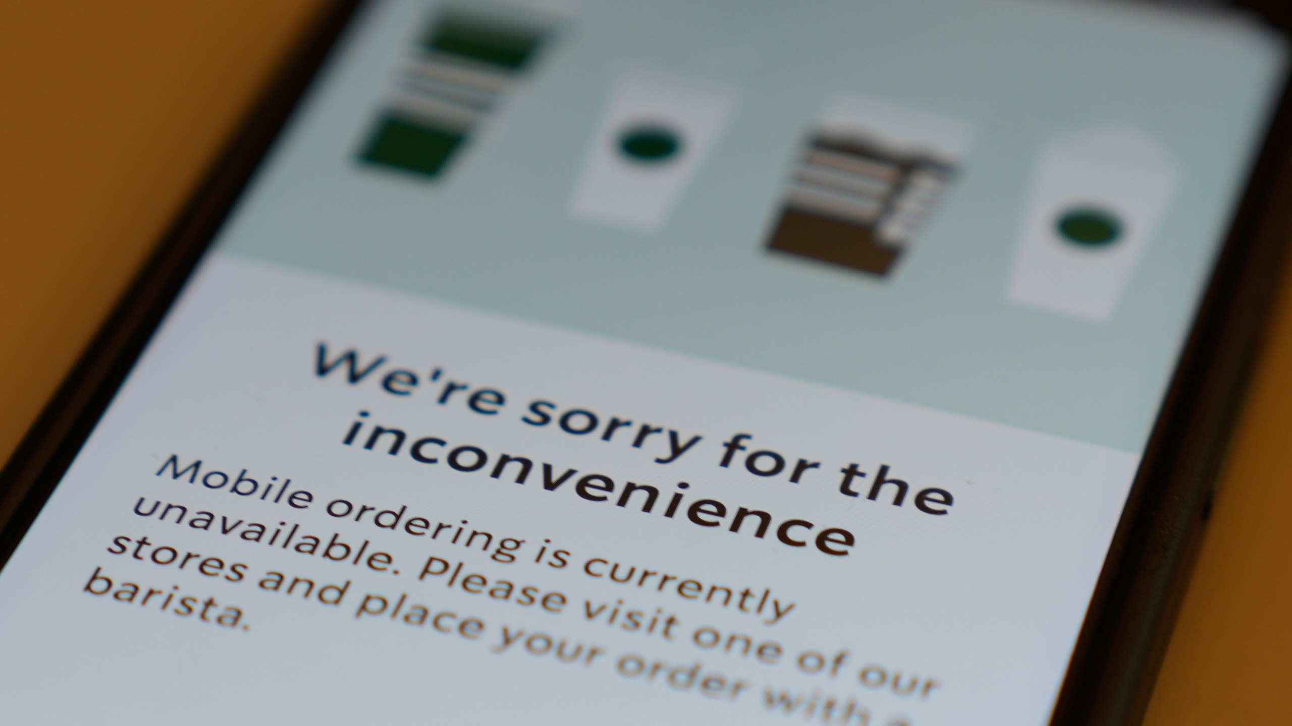 A Starbucks mobile app shows that the mobile ordering is unavailable during the Amazon Web Services outage, Monday, Oct. 20, 2025, in Chicago. (AP Photo/Kiichiro Sato)