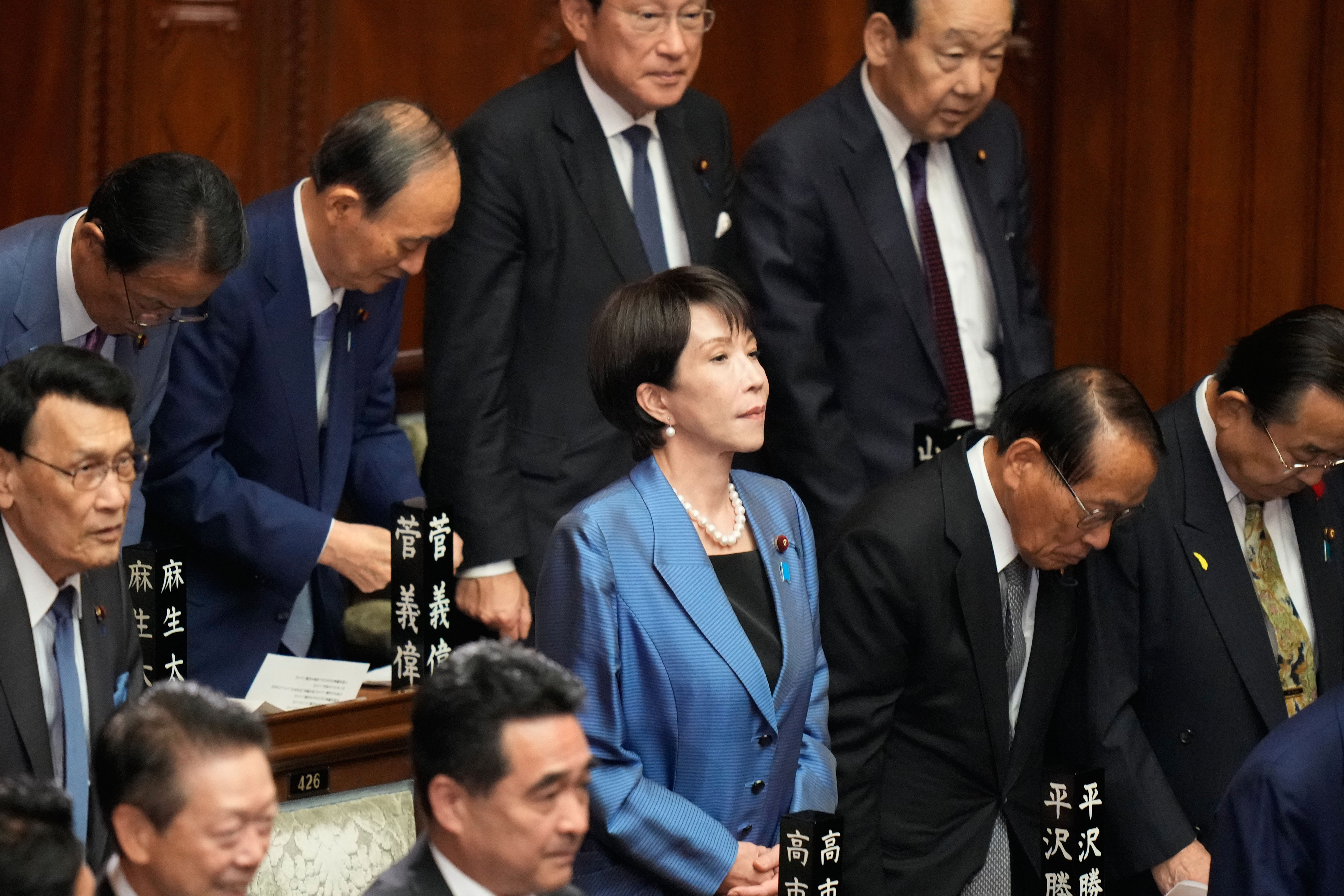 Sanae Takaichi, center, leader of the ruling Liberal Democratic Party, and other lawmakers attend the extraordinary session of the lower house, in Tokyo, Japan, Tuesday, Oct. 21, 2025.(AP Photo/Eugene Hoshiko)