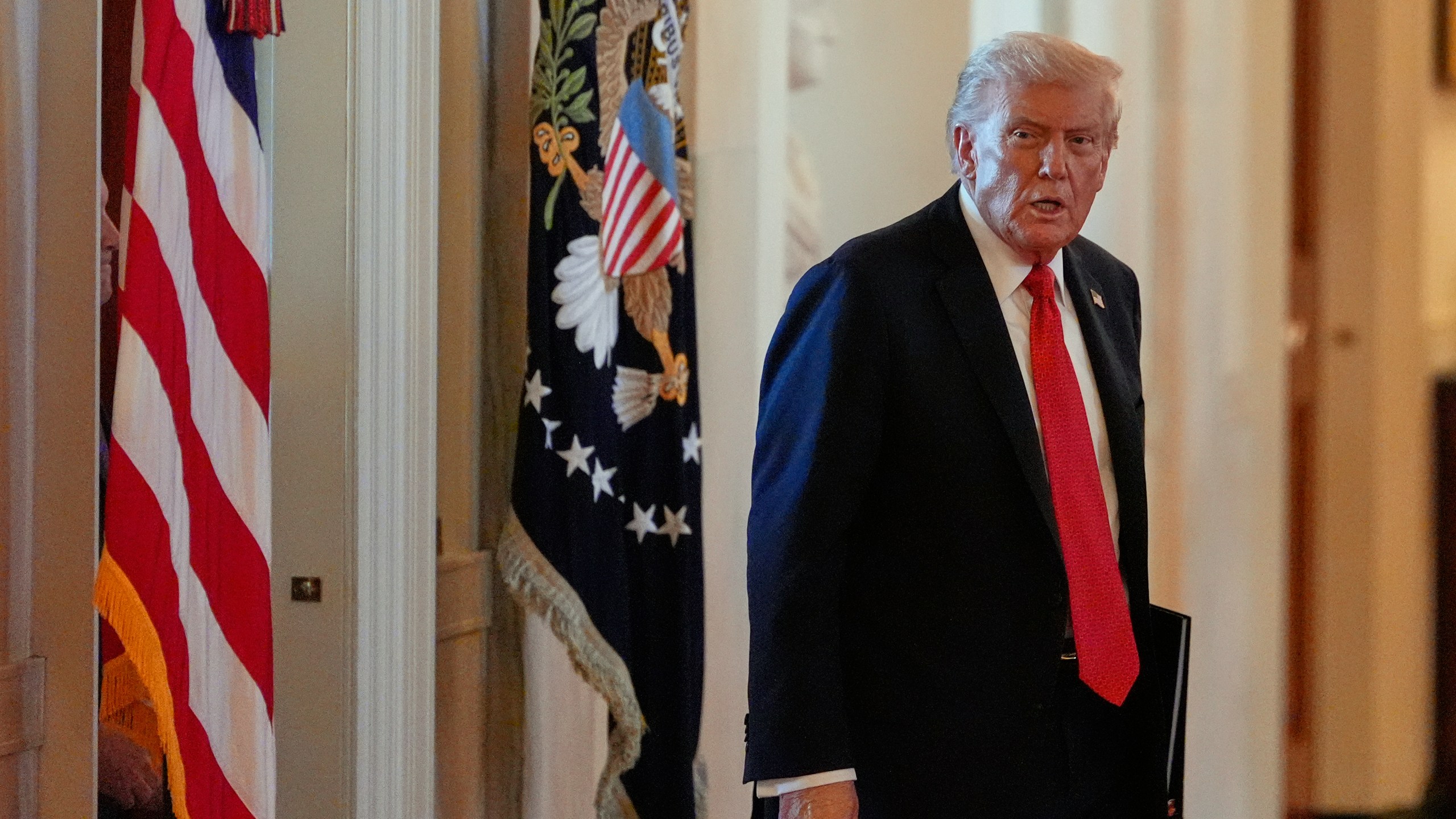 President Donald Trump arrives to speak during an event to welcome the 2025 LSU and LSU-Shreveport national champion baseball teams in the East Room of the White House, Monday, Oct. 20, 2025, in Washington. (AP Photo/Alex Brandon)