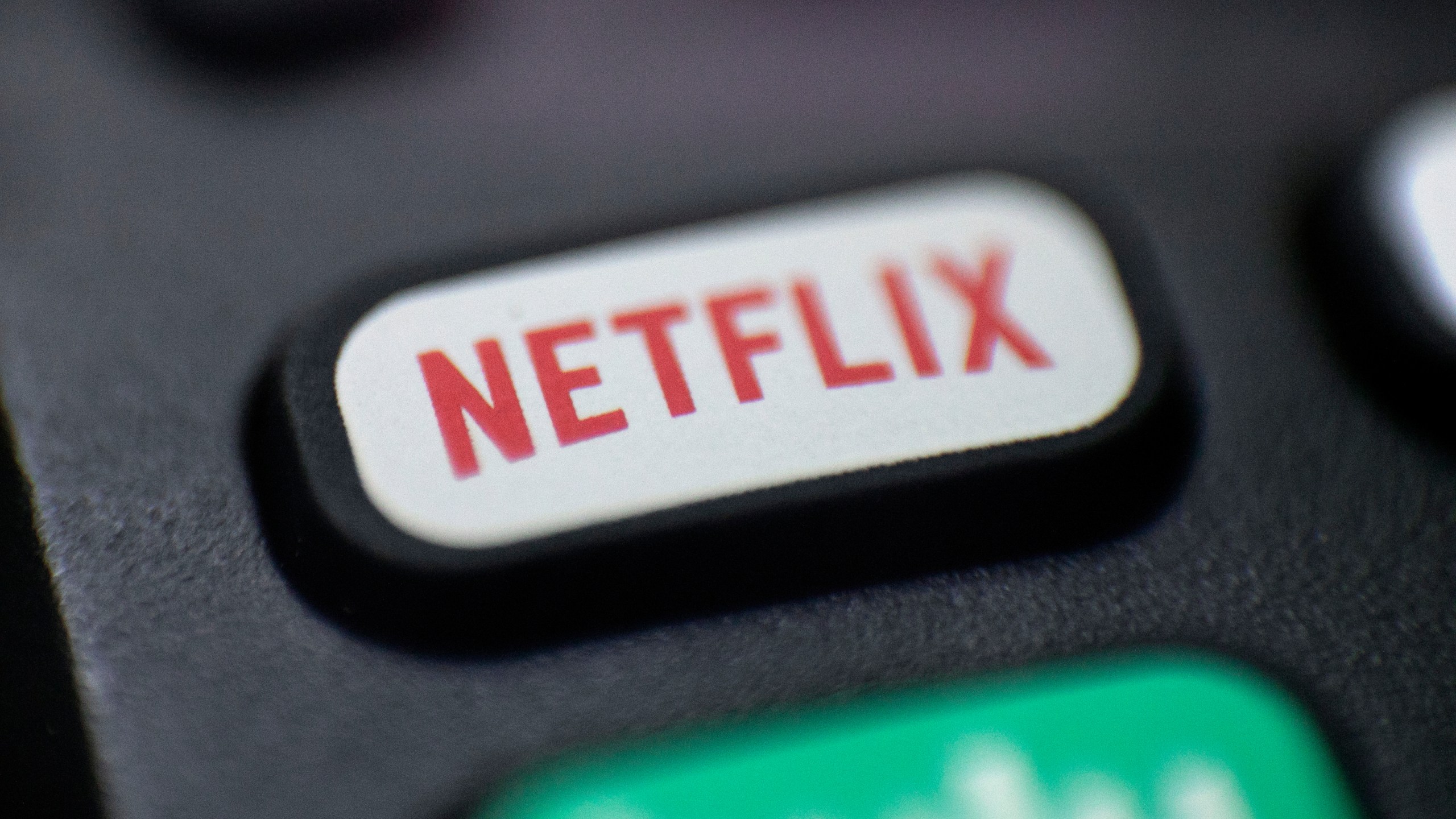 FILE - This Aug. 13, 2020 photo shows a logo for Netflix on a remote control in Portland, Ore. (AP Photo/Jenny Kane, File)
