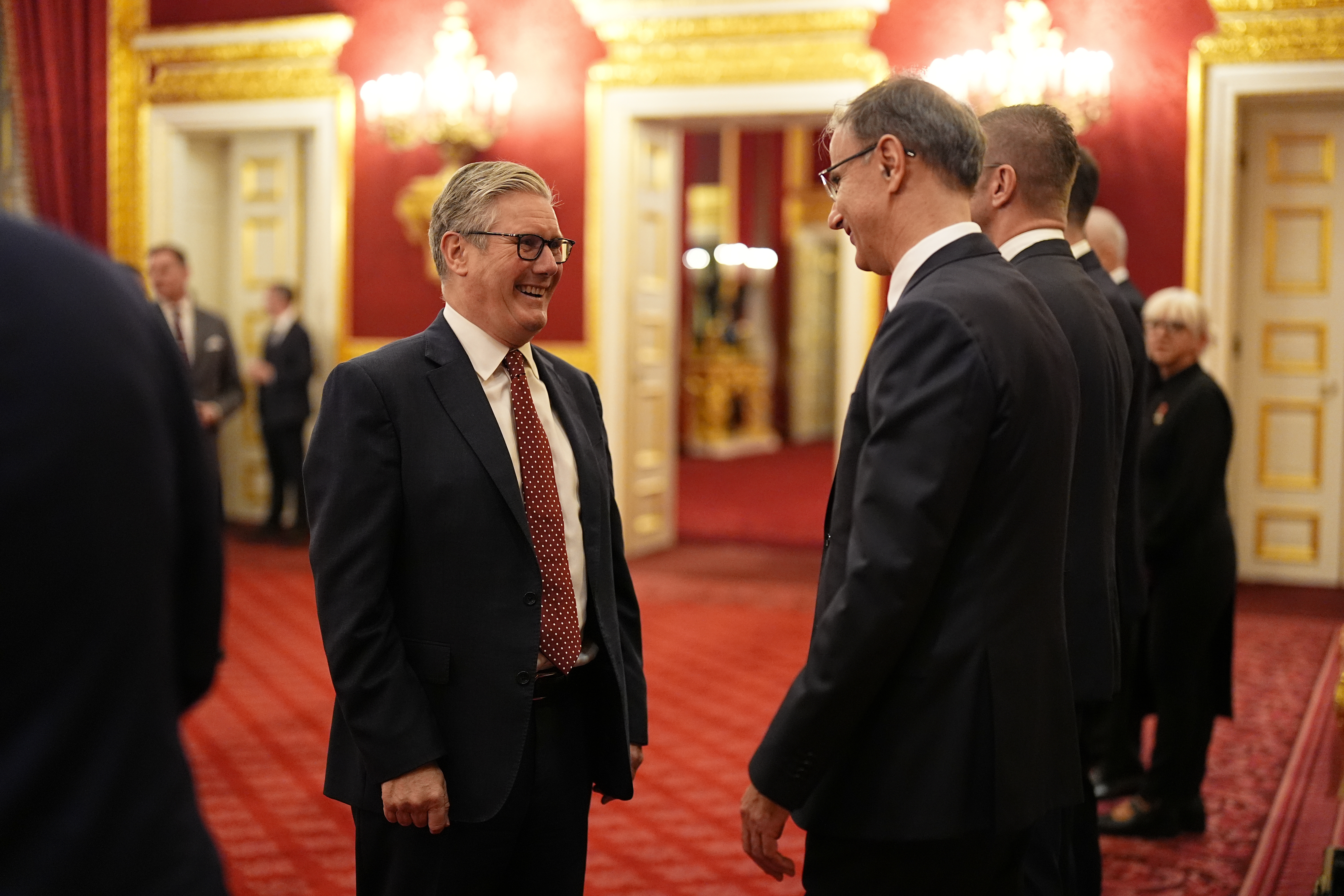 Britain's Prime Minister Sir Keir Starmer, left, speaks with the President of the Government of the Republic of Serbia Duro Macut, during a reception for Western Balkans leaders at St James's Palace, London, Tuesday, Oct. 21, 2025, on the eve of the Western Balkans Leaders' Summit. (Aaron Chown/Pool Photo via AP)