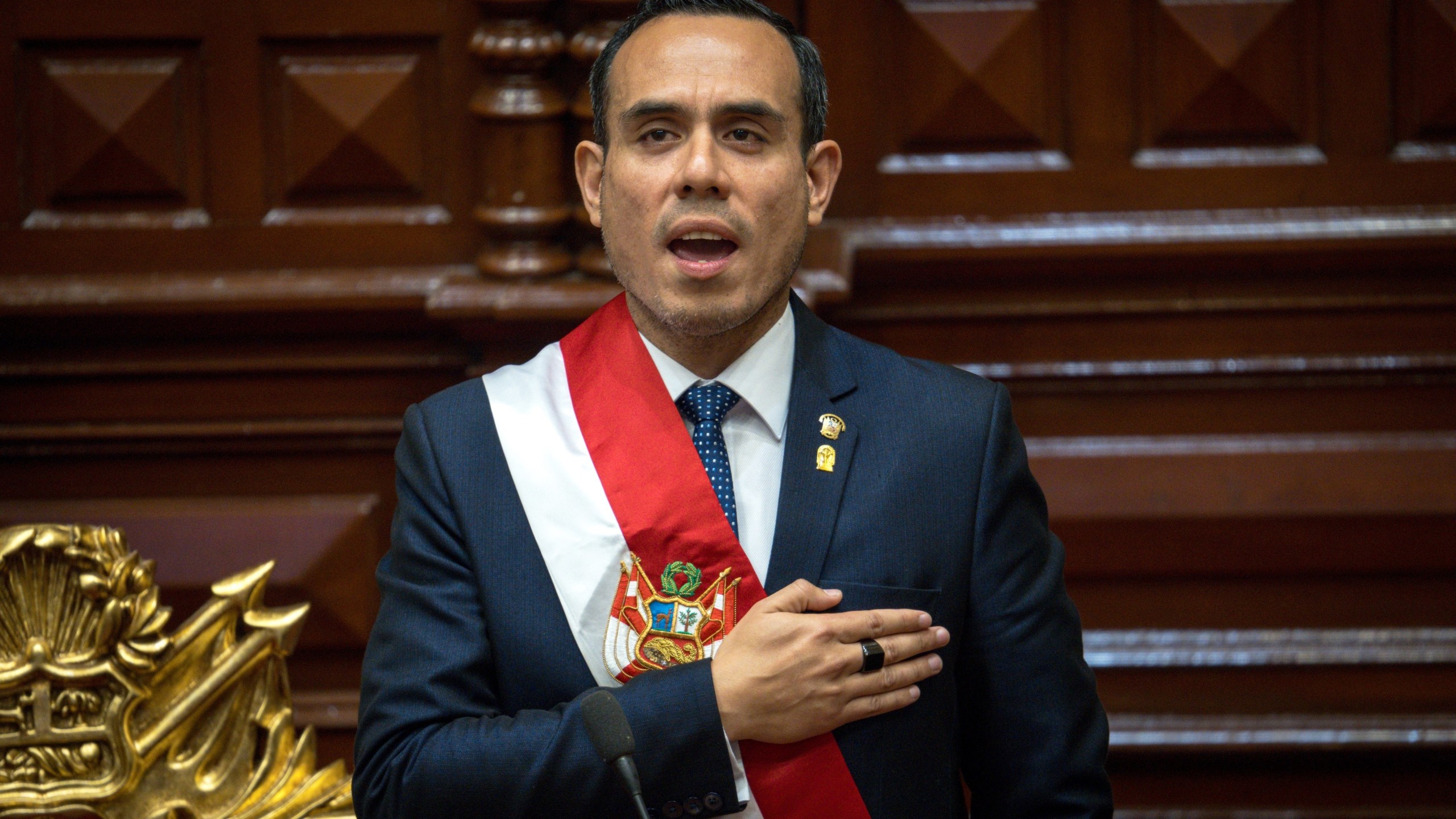 Peru's former president of the Congress Jose Jeri, sings the national anthem after being sworn-in as the interim president in Lima, Peru, Friday, Oct. 10, 2025. (AP Photo/John Reyes)