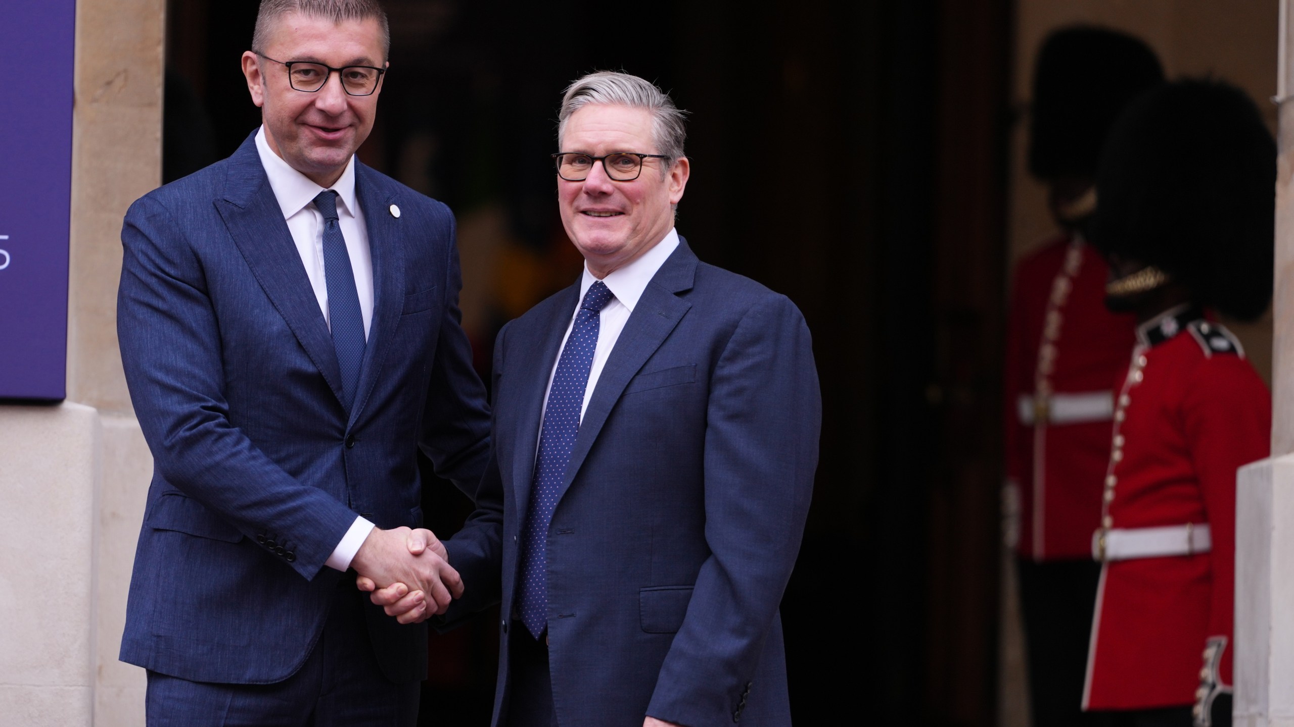Britain's Prime Minister Keir Starmer welcomes North Macedonia's Prime Minister Hristijan Mickoski to a meeting of leaders of six Western Balkan nations with British and European officials at a Western Balkans Summit in London, Wednesday, Oct. 22, 2025.(AP Photo/Kirsty Wigglesworth, Pool)