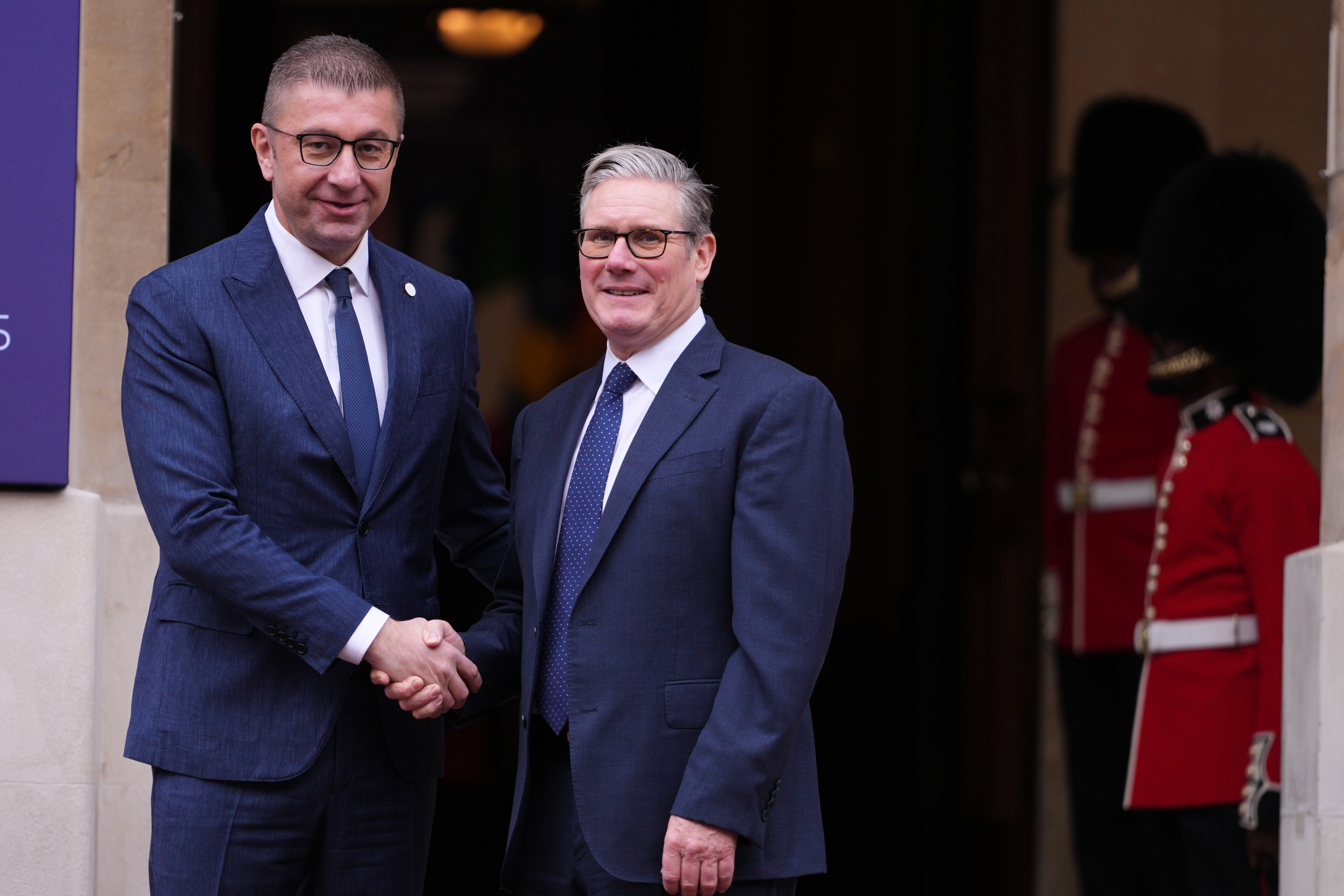Britain's Prime Minister Keir Starmer welcomes North Macedonia's Prime Minister Hristijan Mickoski to a meeting of leaders of six Western Balkan nations with British and European officials at a Western Balkans Summit in London, Wednesday, Oct. 22, 2025.(AP Photo/Kirsty Wigglesworth, Pool)