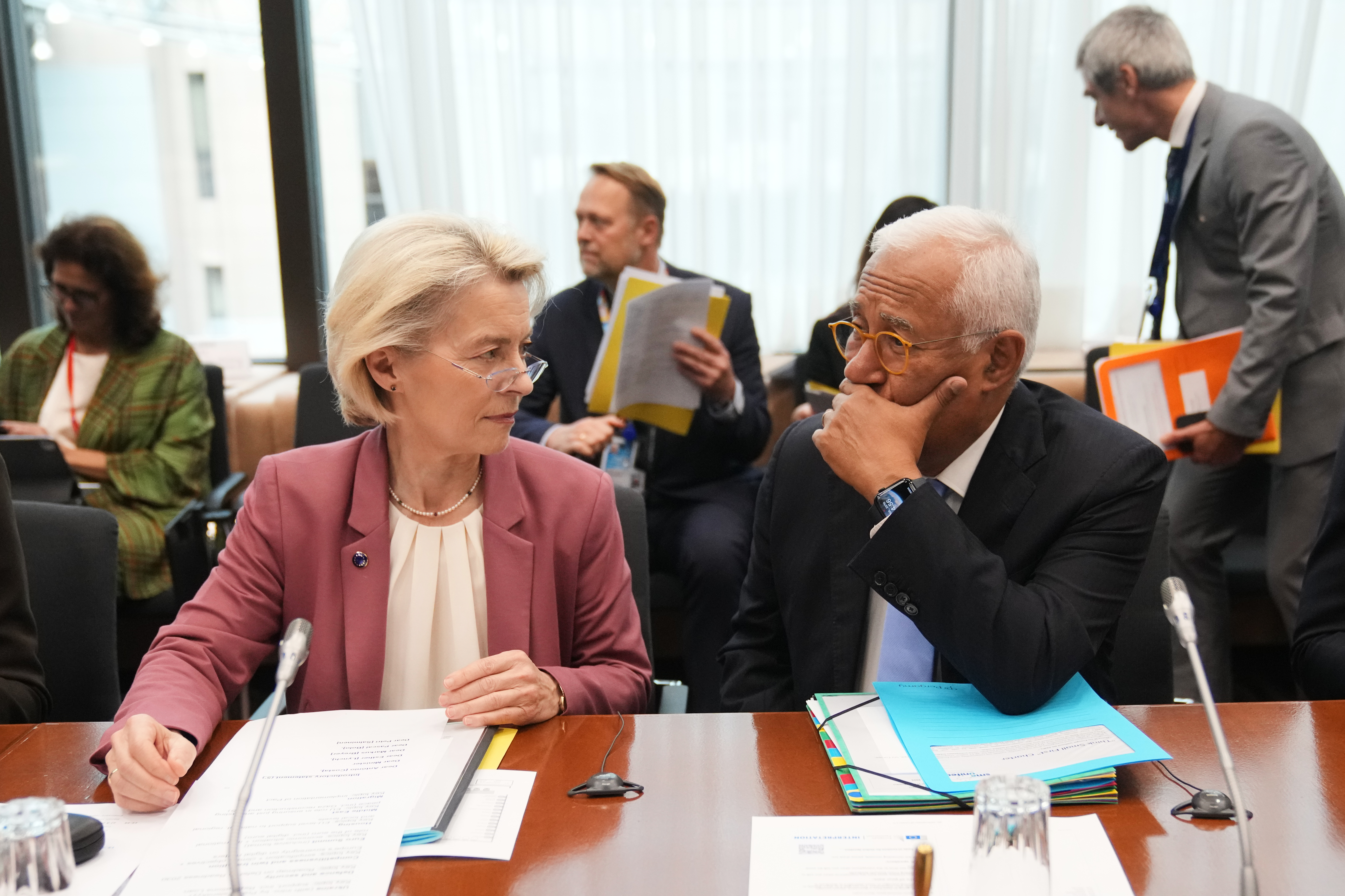 European Commission President Ursula von der Leyen, left, and European Council President Antonio Costa wait for the start of the Tripartite Social Summit at the European Council building in Brussels, Wednesday, Oct. 22, 2025. (AP Photo/Virginia Mayo)