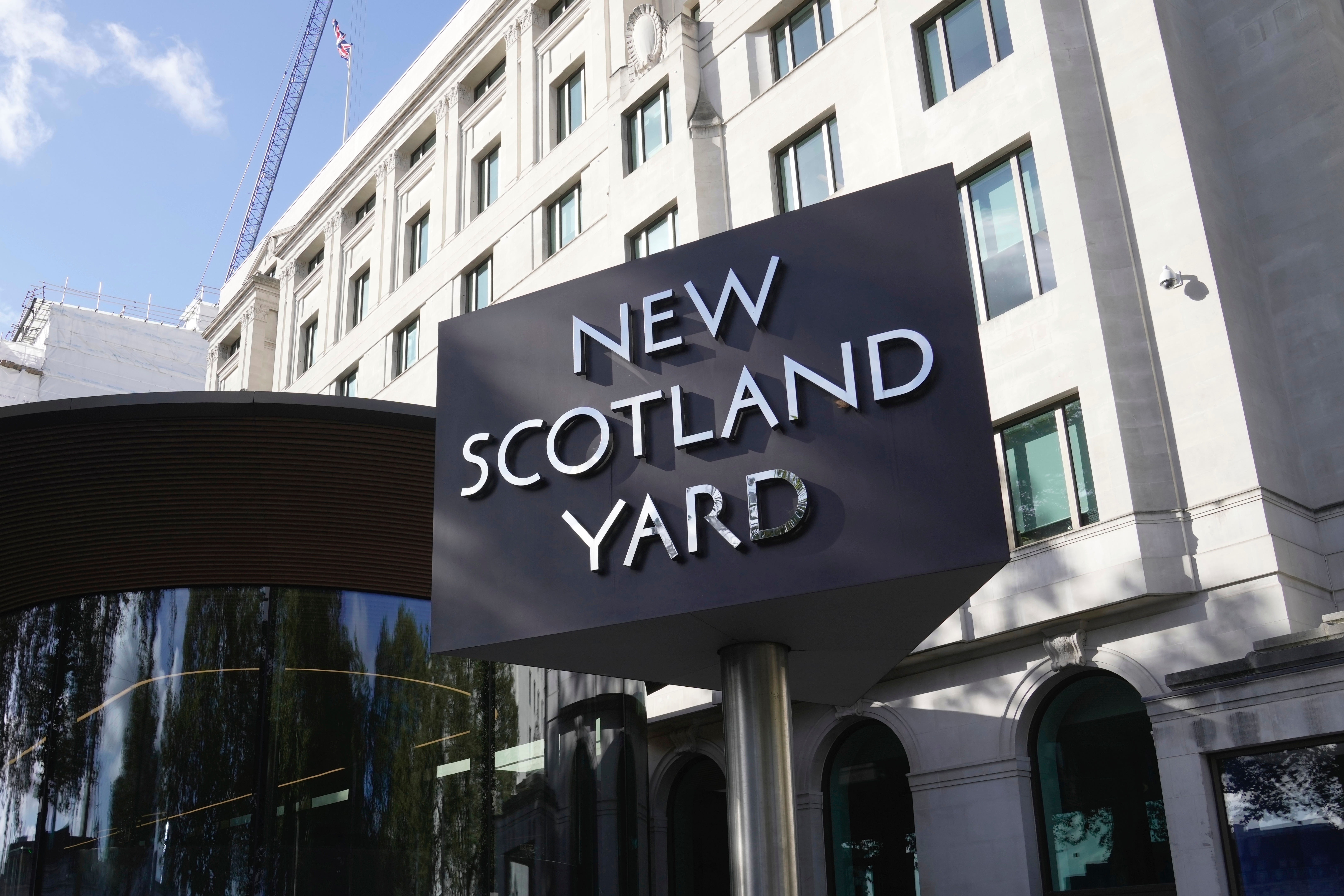 FILE - A sign stands in front of the New Scotland Yard, the headquarters of the London Metropolitan Police, in London, on Sept. 25, 2023. (AP Photo/Kin Cheung, File)