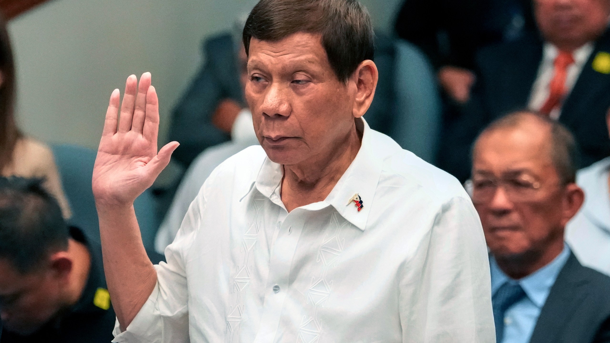 FILE - Former Philippine President Rodrigo Duterte takes oath during a senate inquiry on the so-called war on drugs during his administration at the Philippine Senate, on Oct. 28, 2024, in Manila, Philippines. (AP Photo/Aaron Favila, File)