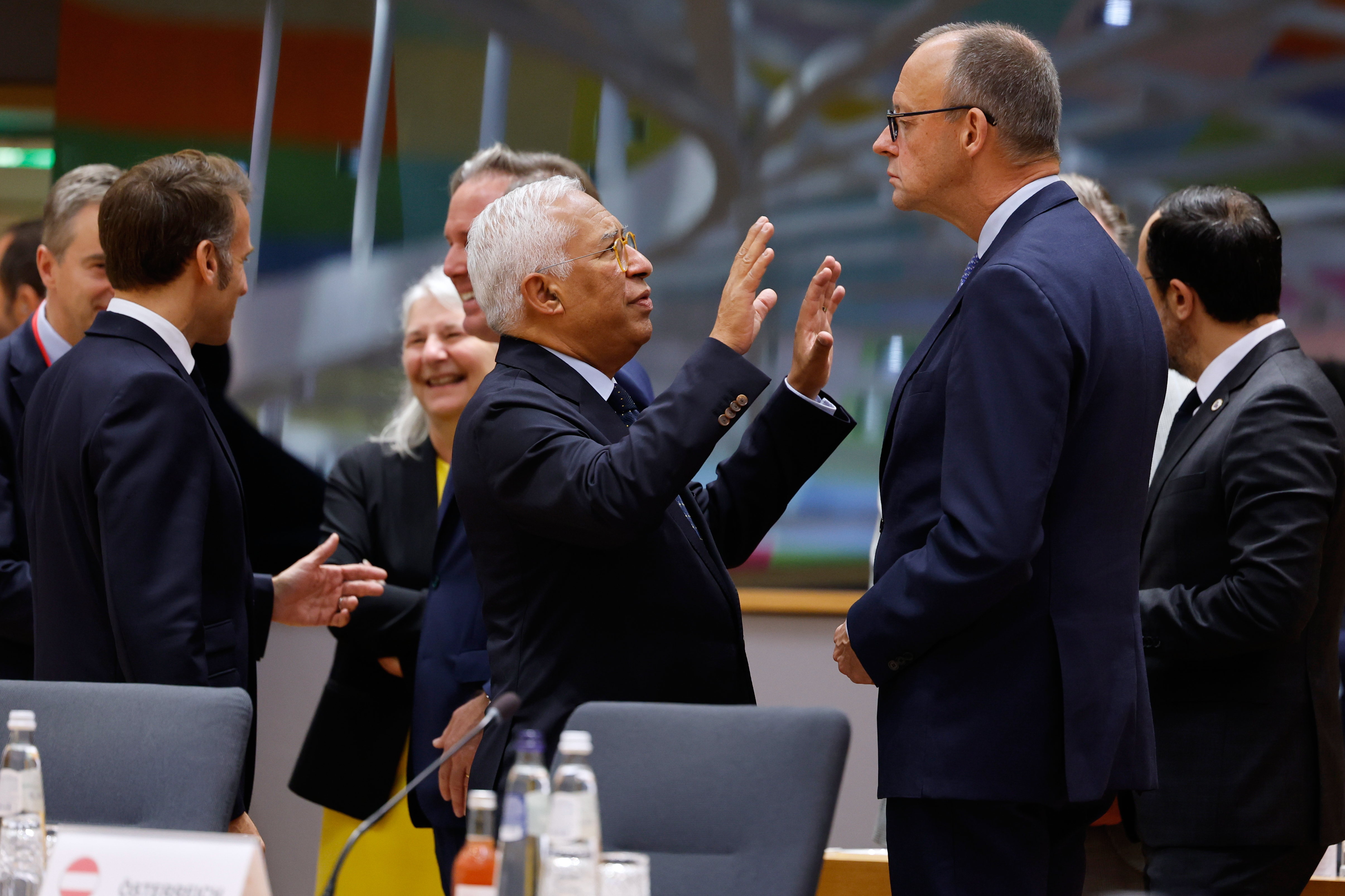 European Council President Antonio Costa, center, speaks with Germany's Chancellor Friedrich Merz, center right, during a round table meeting at an EU Summit in Brussels, Thursday, Oct. 23, 2025. (AP Photo/Geert Vanden Wijngaert)