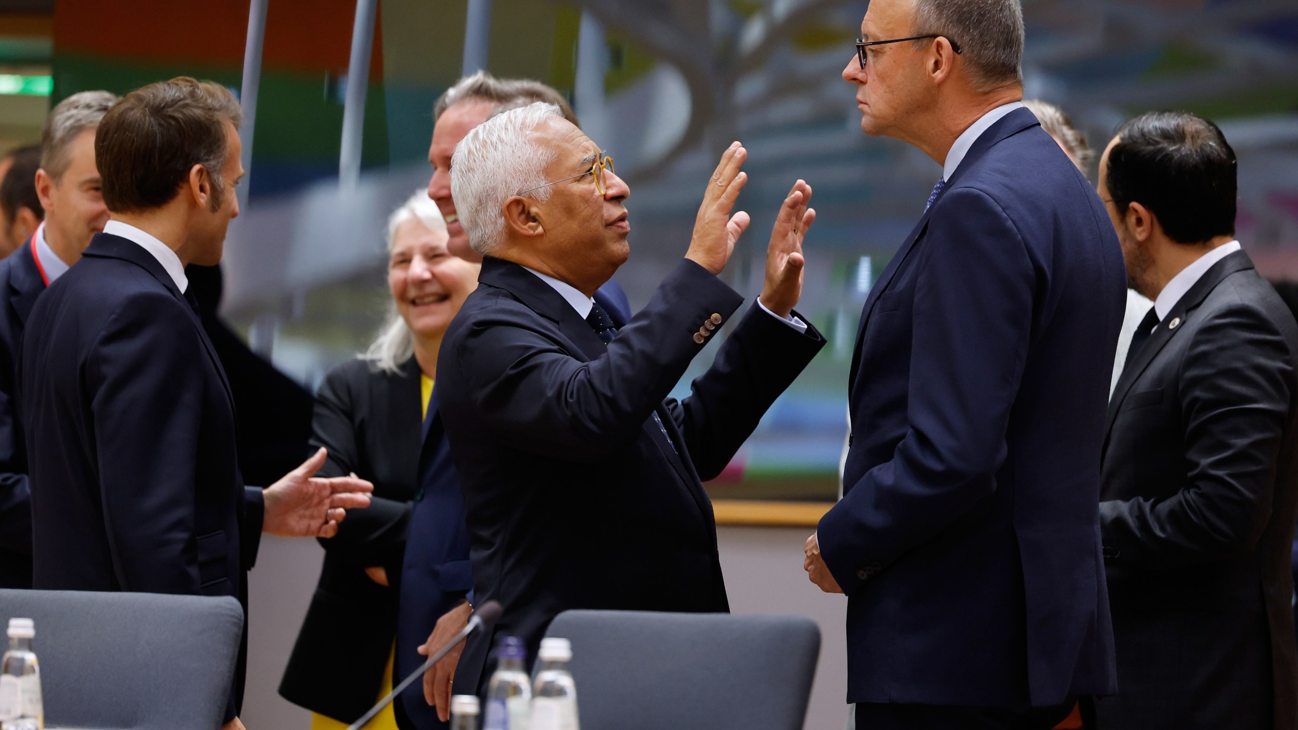 European Council President Antonio Costa, center, speaks with Germany's Chancellor Friedrich Merz, center right, during a round table meeting at an EU Summit in Brussels, Thursday, Oct. 23, 2025. (AP Photo/Geert Vanden Wijngaert)