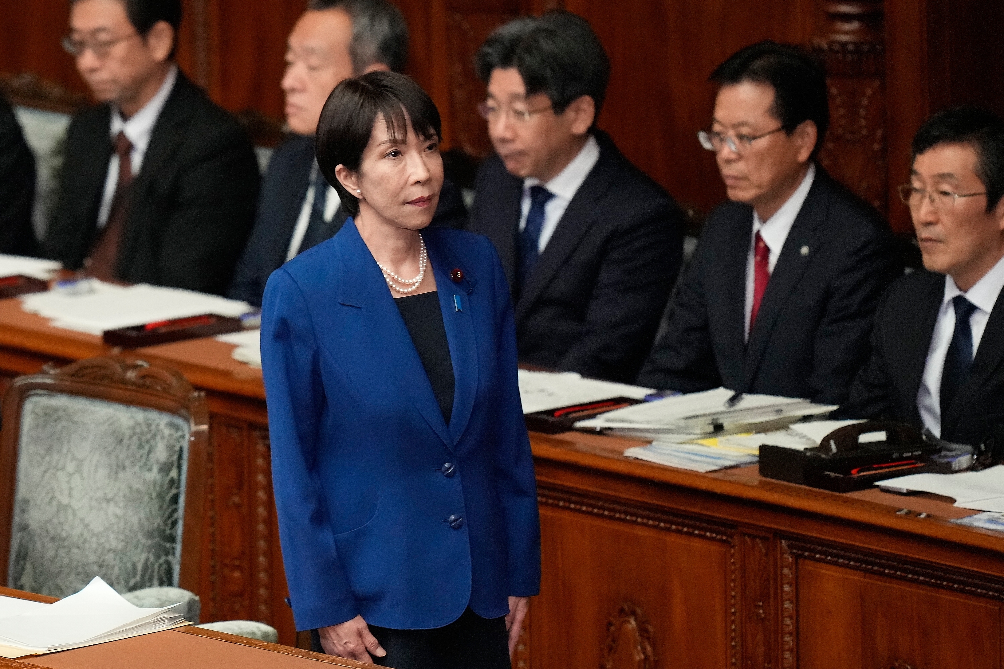 Japan's Prime Minister Sanae Takaichi stands before delivering a policy speech at the extraordinary session of parliament's lower house Friday, Oct. 24, 2025, in Tokyo. (AP Photo/Eugene Hoshiko)