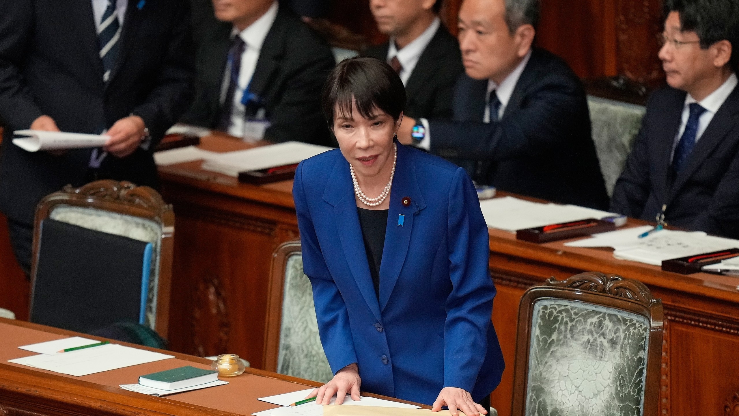 Japan's Prime Minister Sanae Takaichi bows before delivering a policy speech at the extraordinary session of parliament's lower house Friday, Oct. 24, 2025, in Tokyo. (AP Photo/Eugene Hoshiko)