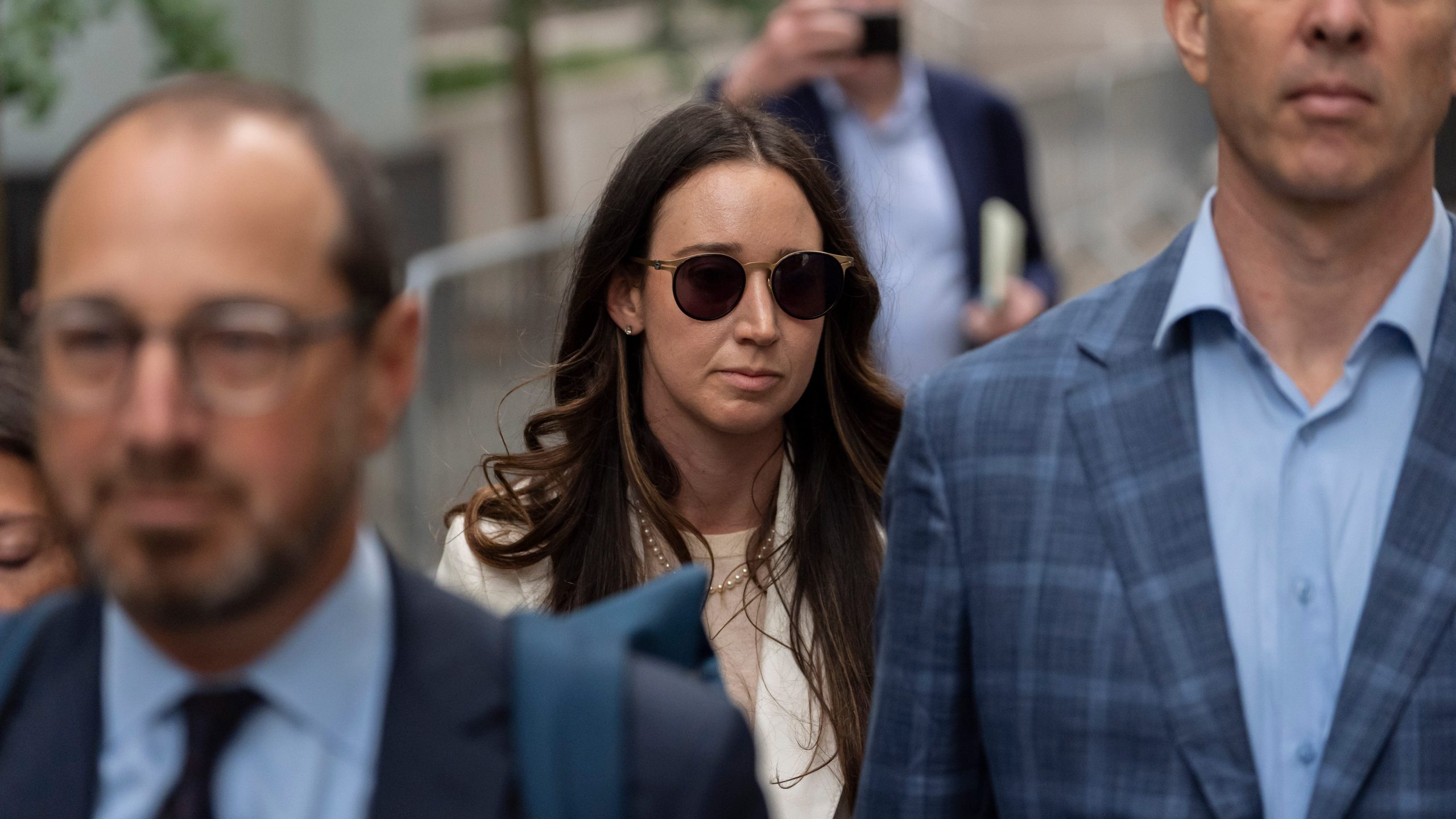 FILE - Charlie Javice, center, exits Manhattan federal court, Monday, Sept. 29, 2025, in New York. (AP Photo/Yuki Iwamura, File)