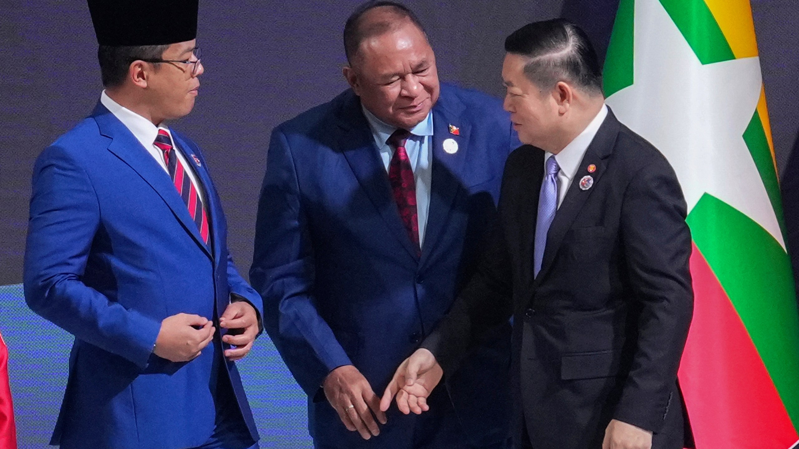 Indonesia's Foreign Minister Sugiono, left, and East Timor's Foreign Minister Bendito dos Santos Freitas, center, speak with ASEAN Secretary-General Kao Kim Hourn during the ASEAN foreign ministers/ meeting in Kuala Lumpur, Malaysia, Saturday, Oct. 25, 2025. (AP Photo/Rafiq Maqbool)