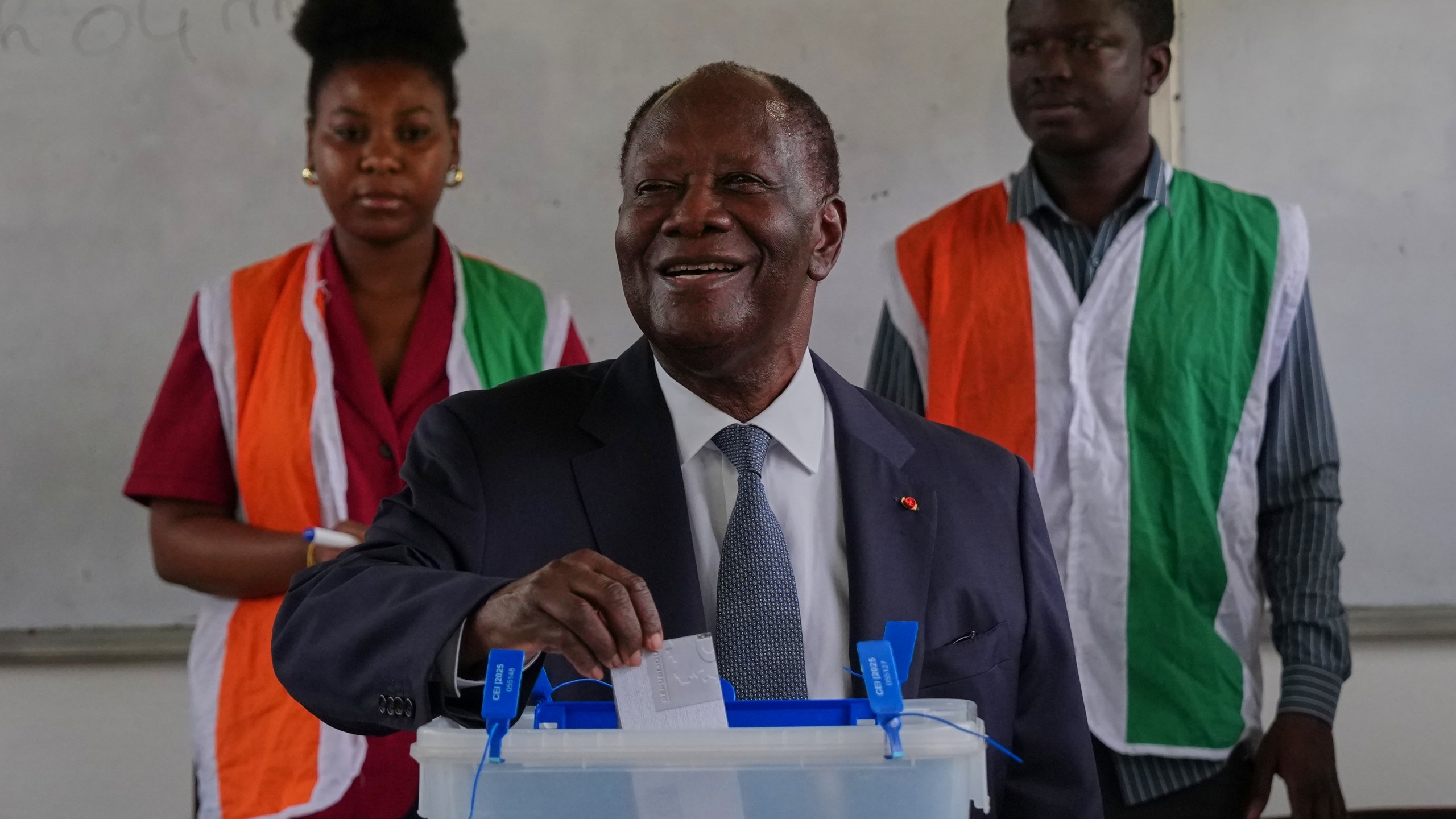 Ivory Coast President Alassane Ouattara casts his vote at a polling station during the presidential elections in Abidjan, Ivory Coast, Saturday, Oct. 25, 2025. (AP Photo/Misper Apawu)