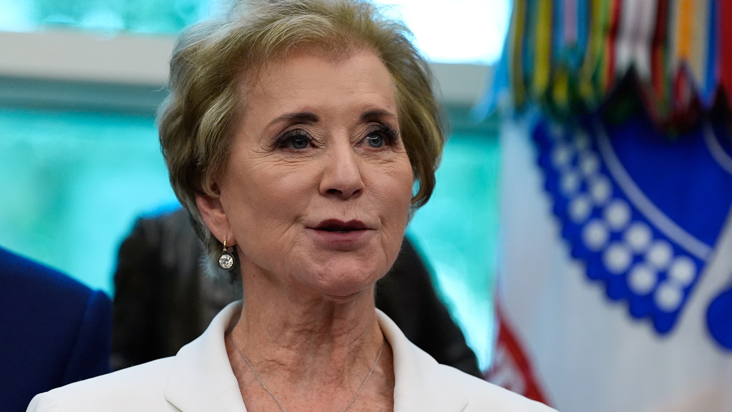 Education Secretary Linda McMahon speaks in the Oval Office of the White House before President Donald Trump signs an executive order regarding childhood cancer and the use of AI, Tuesday, Sept. 30, 2025, in Washington. (AP Photo/Alex Brandon)